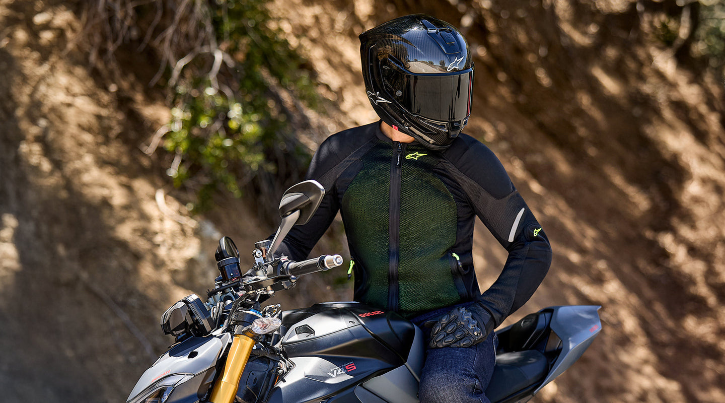 Image 406080520570 Motorcycle rider wearing the Alpinestars Troop Air Pro jacket in the green version