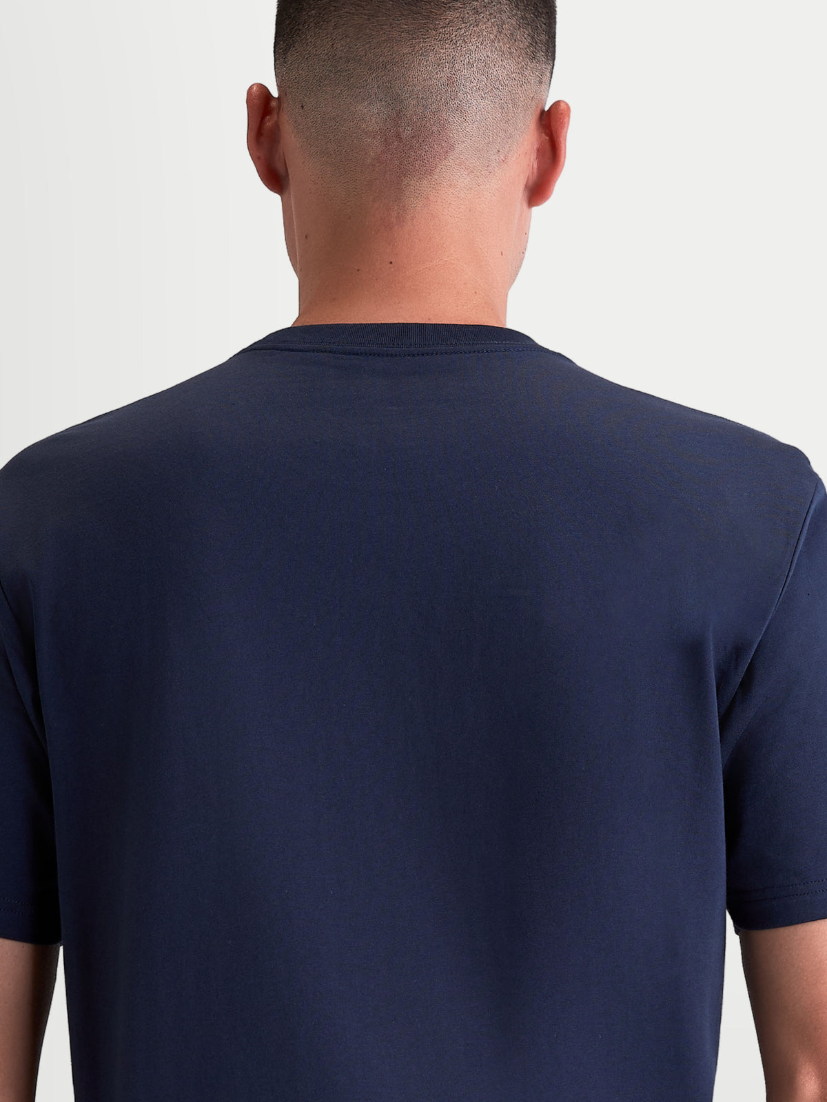 Alpinestars Ageless 2.0 CSF Tee, Navy Blue Sportswear T-Shirt, Unisex Casual Apparel, Back View on Model showing the cut-and-sew fit and premium cotton-poly blend construction.