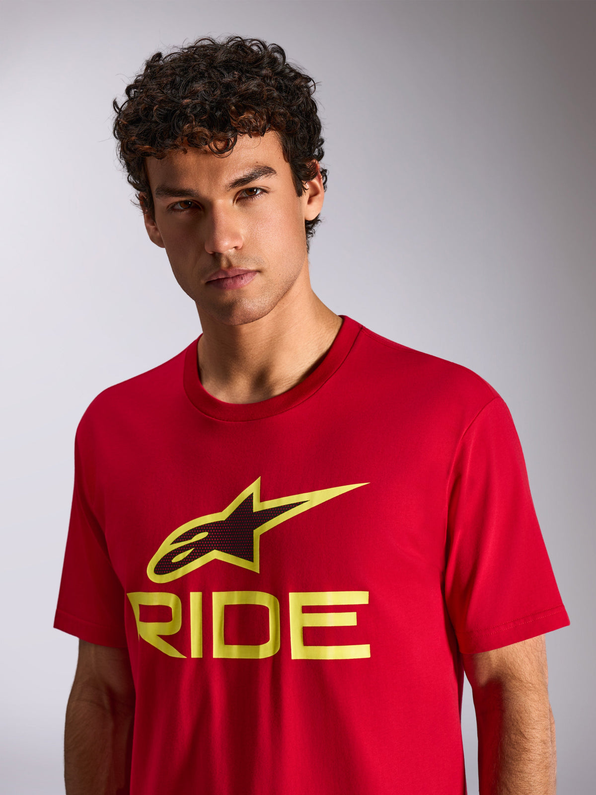 Alpinestars Ride 4.0 CSF Tee, Short Sleeve T-Shirt, Red with Hi-Vis Yellow and Black Ride Logo, worn by model, Casual Motorsport Streetwear