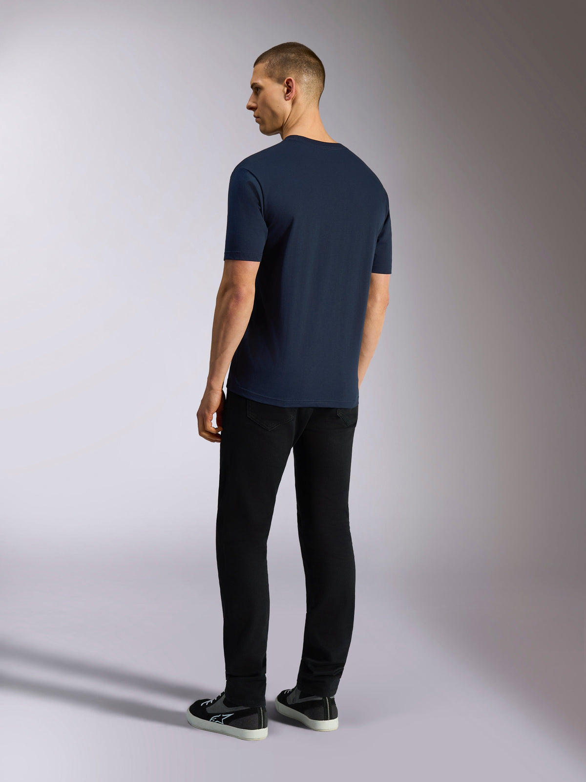 Alpinestars Noka CSF Tee, Short Sleeve T-Shirt, Navy Blue, back view shown on model wearing black pants and sneakers, casual motorsport streetwear
