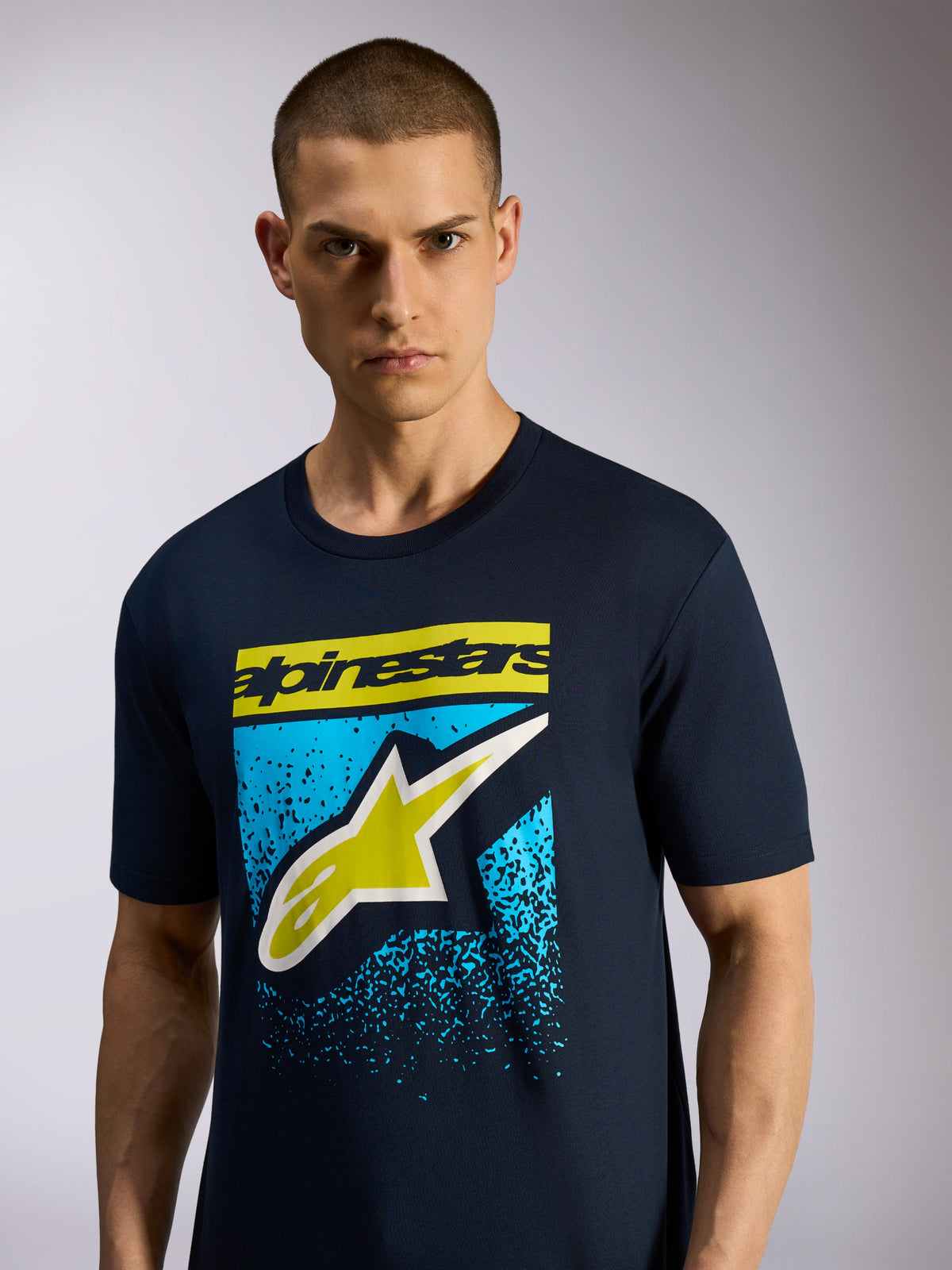 Alpinestars Noka CSF Tee, Short Sleeve T-Shirt, Navy Blue, features front Astars logo with yellow wordmark and blue speckled graphic, Casual Motorsport Sportswear
