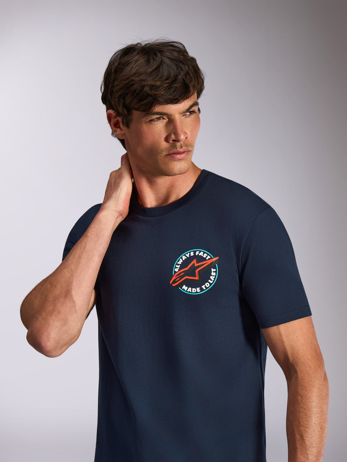 Alpinestars Aorbit CSF Tee, Short Sleeve T-Shirt, Navy Blue, circular chest graphic with orange star logo and Always Fast Made to Last text, casual motorsport streetwear