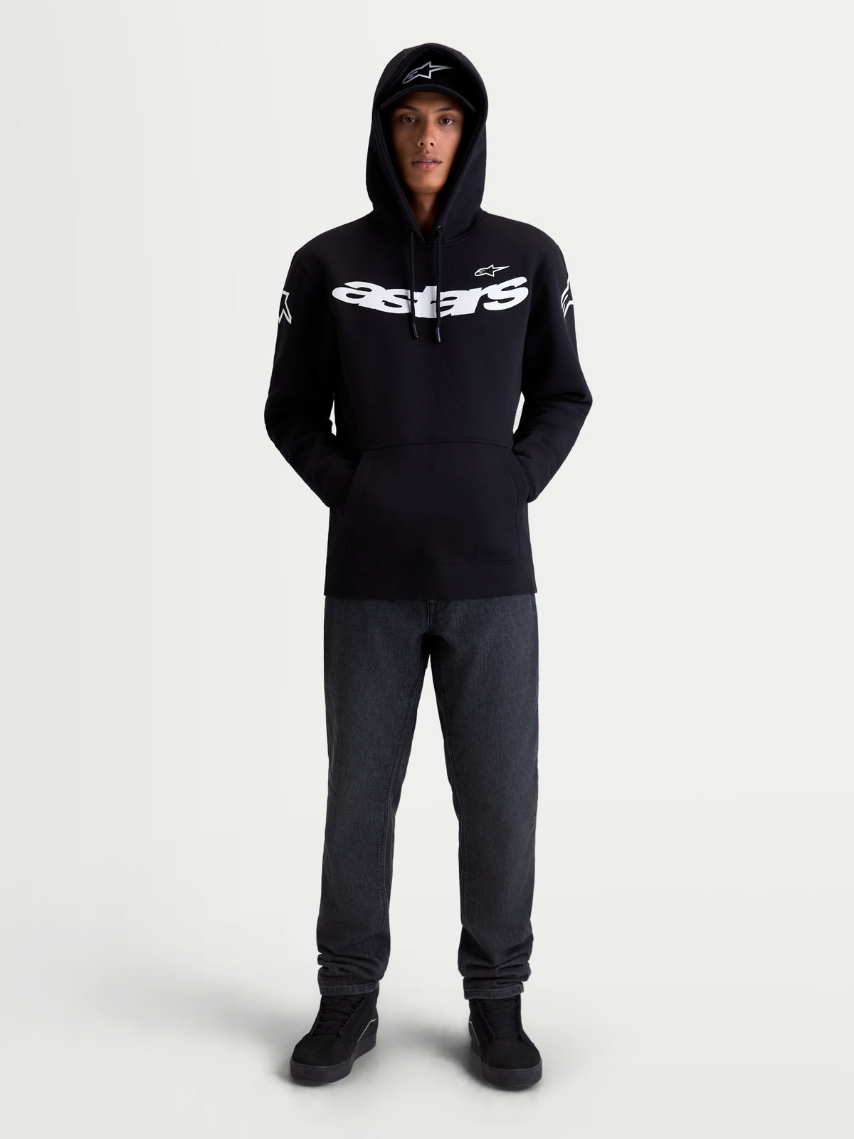 Alpinestars Velocifier Hoodie, Motorcycle Sportswear Pullover Fleece, Unisex, Black and White, Cotton and Recycled Polyester Blend, featuring bold Astars chest branding and shoulder logos, on-model front view for off-bike casual wear.