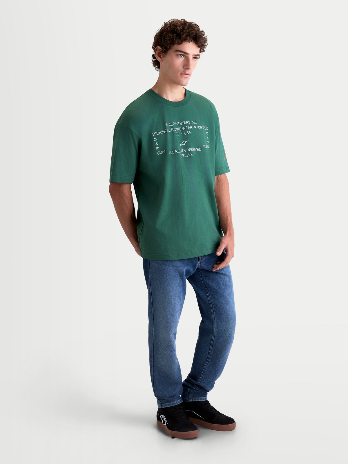 Alpinestars Infinity Oversized CSF Tee, Men's Green Short Sleeve Sportswear T-Shirt featuring a white technical riding wear front graphic, oversized fit, and premium cotton-poly blend construction for casual off-bike comfort.