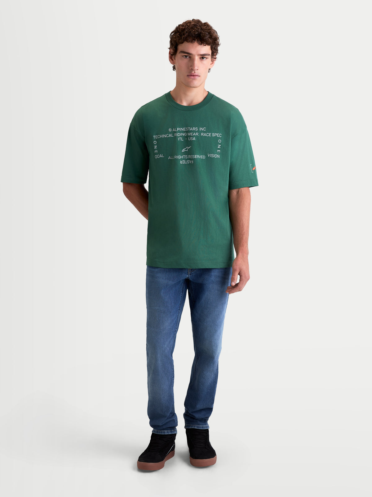 Alpinestars Infinity Oversized CSF Tee, green short-sleeve sportswear t-shirt for men and women, featuring a white Alpinestars Inc chest graphic and sleeve logo, oversized fit, premium cotton-poly blend.