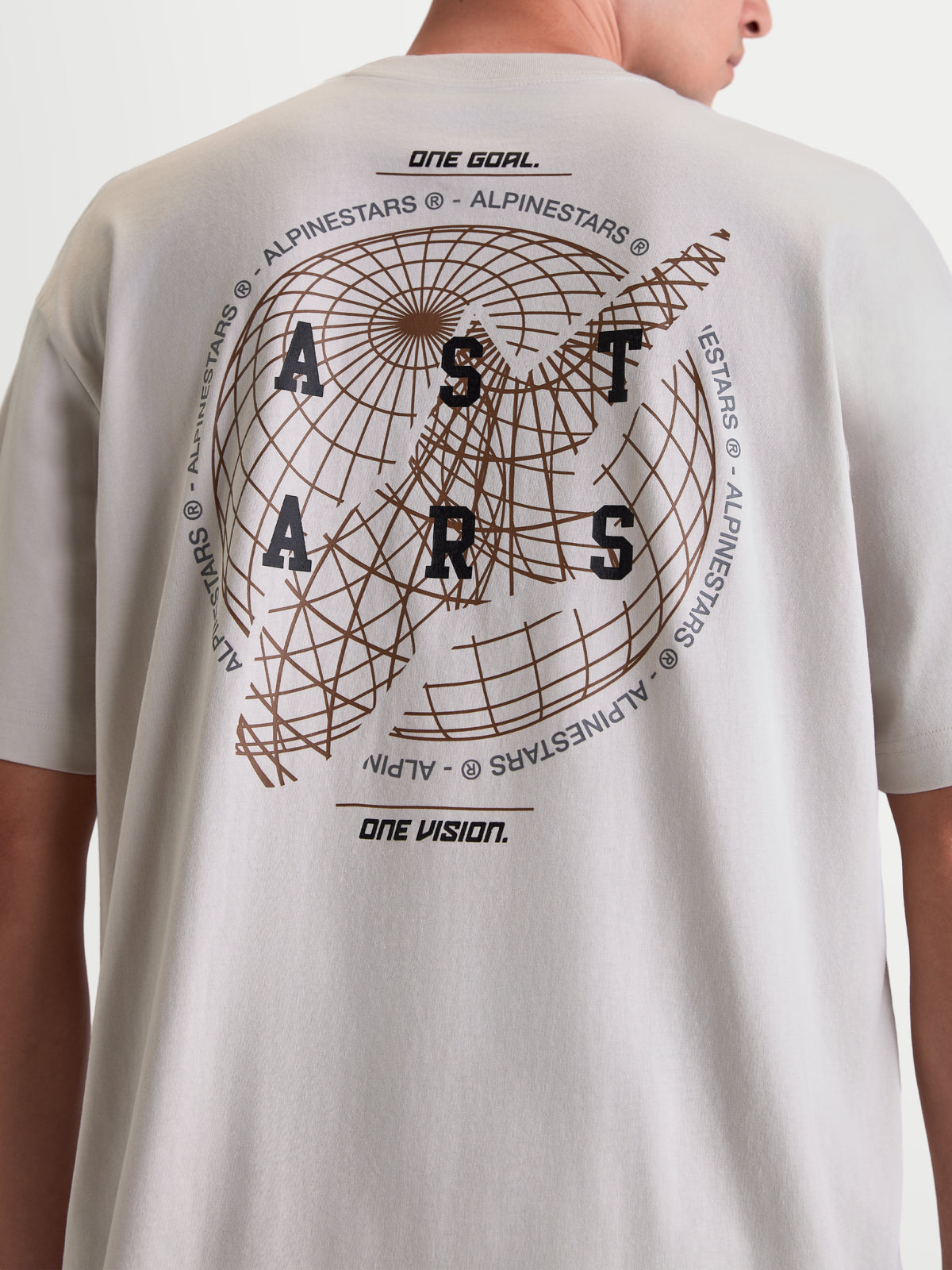 Alpinestars Latitude Oversized CSF Tee, Short Sleeve Sportswear T-Shirt, Cement Gray, back view featuring large globe graphic with ASTARS wordmark and One Goal One Vision mottos, relaxed oversized fit, cotton-poly blend.