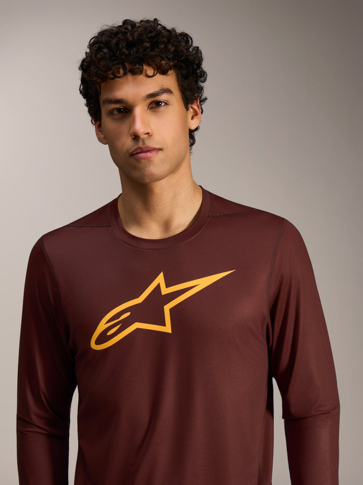 Bordeaux A-Dura Ride Long Sleeve Jersey featuring a yellow Alpinestars logo on the chest, performance MTB apparel.