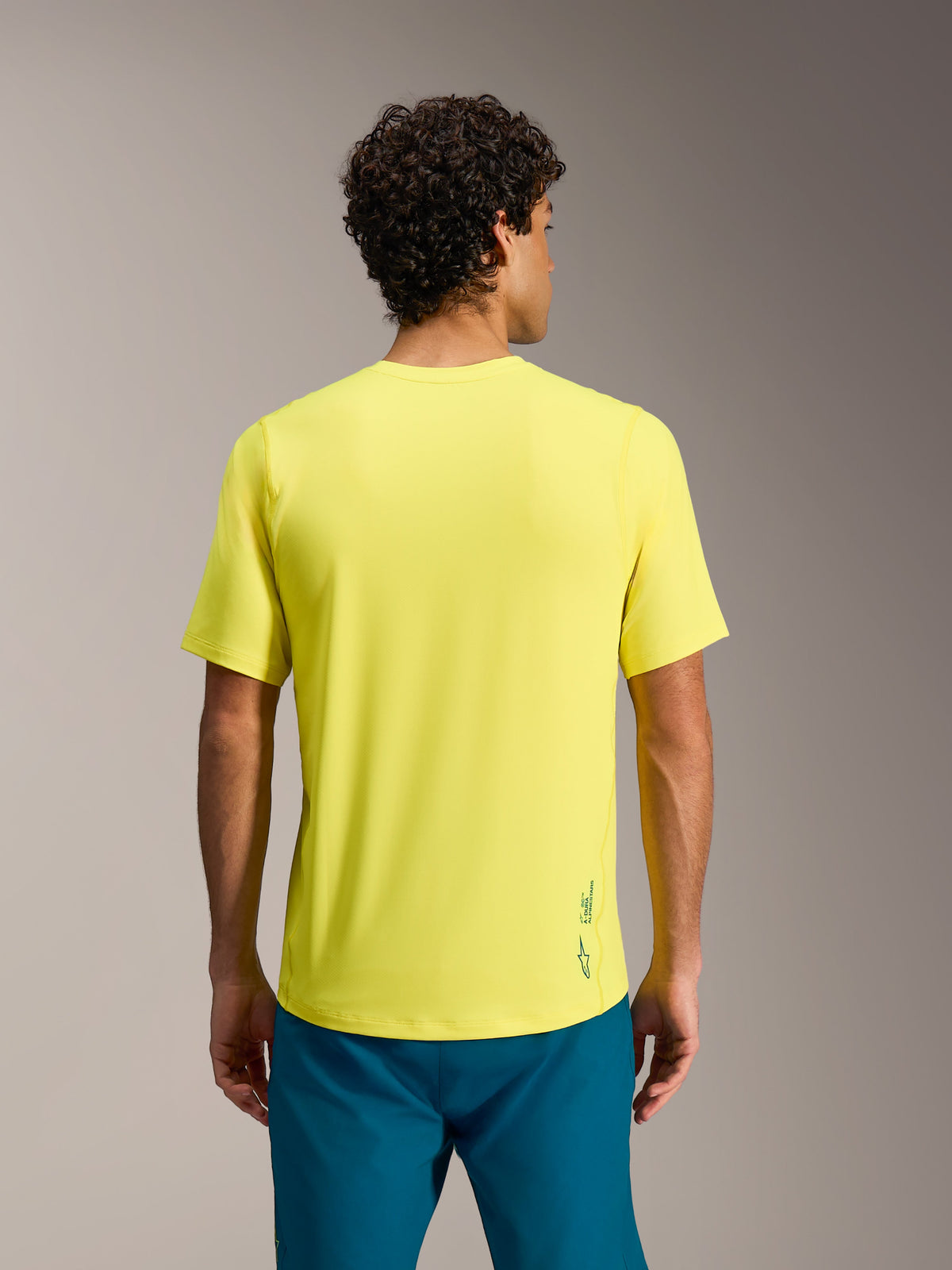 A-Dura Ride jersey in Yellow Fluo, achteraanzicht met normale pasvorm en Astars-logo op de onderrug.