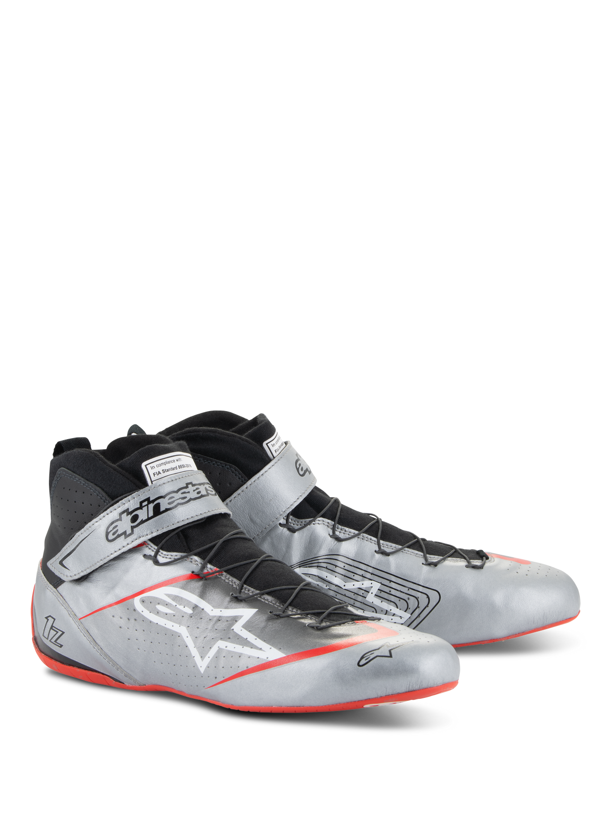 Alpinestars Tech-1 Z V3 Shoes FIA, autosportschoenen, donkerzilver met zwarte en rode accenten, metallic zilveren lederen bovenwerk met zwart snelvetersysteem, enkelband met merklogo en dunne rode zoolaccenten.