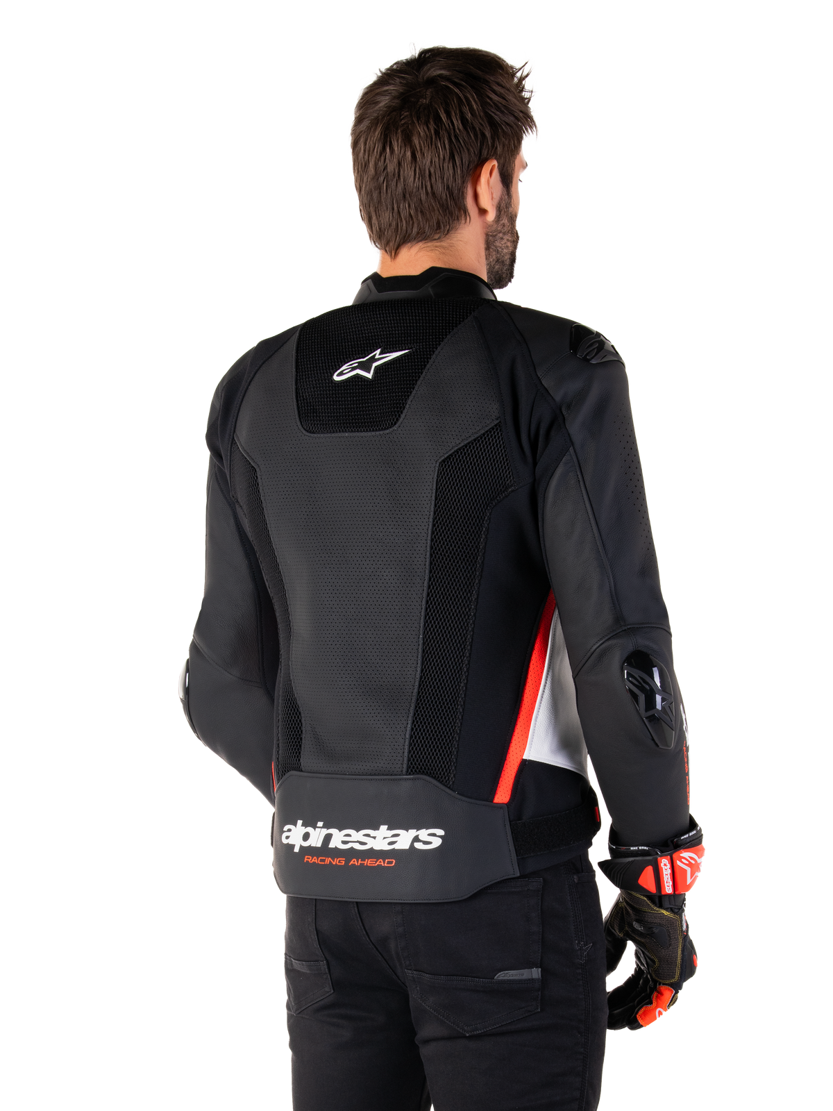 Alpinestars Missile V3 Airflow Leren Jas, achteraanzicht, zwart wit en rood fluo, met uitgebreide perforaties voor koeling, externe DFS-sliders op schouders en ellebogen, en Alpinestars-logo op de onderrug.