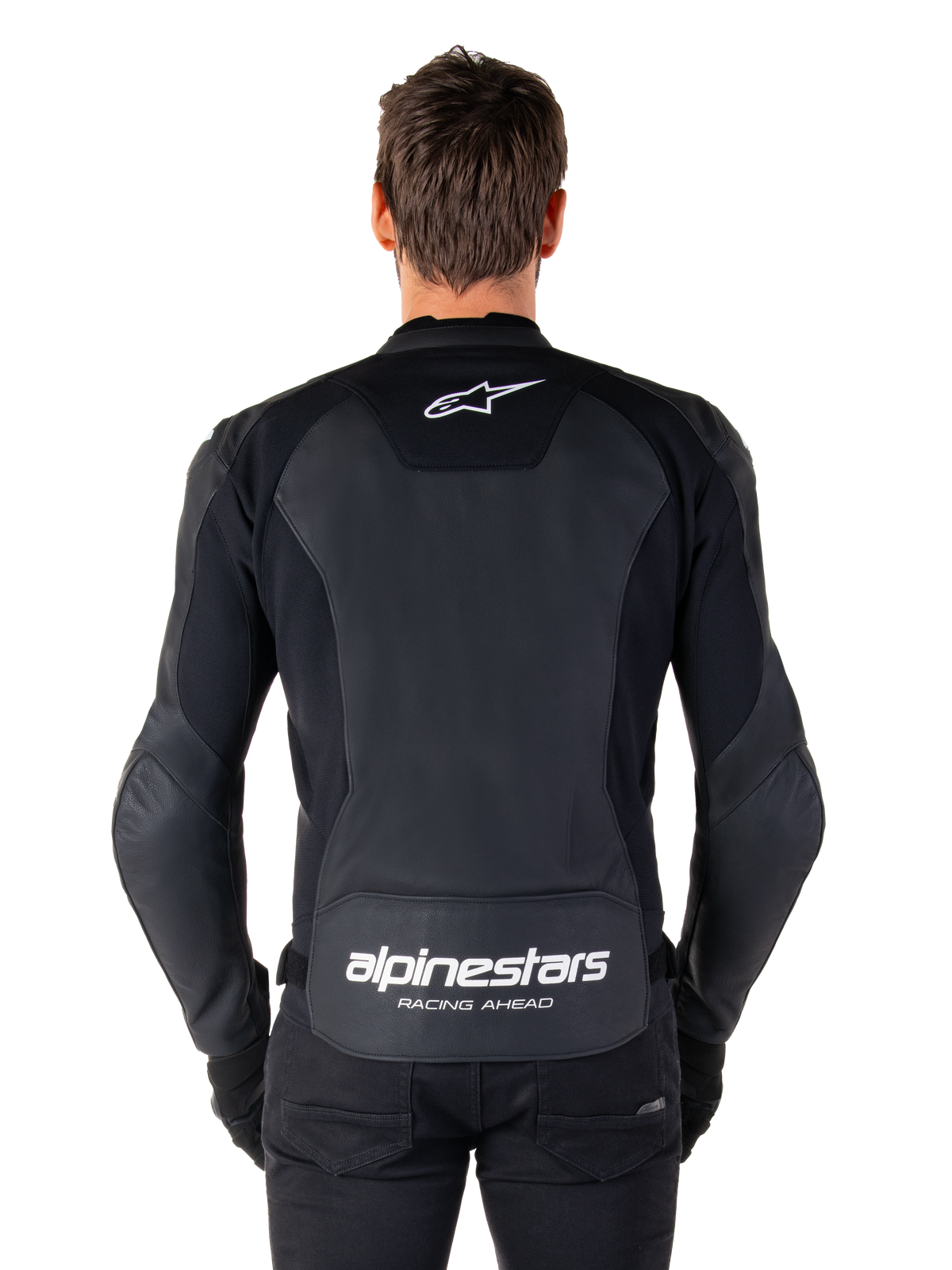 Alpinestars Faster V3 Leather Jacket, Sport Motorcycle Jacket, Black with white branding, rear view worn by model, featuring the Alpinestars logo on the upper back and 'RACING AHEAD' text on the lower back, premium leather construction with ergonomic stretch panels.