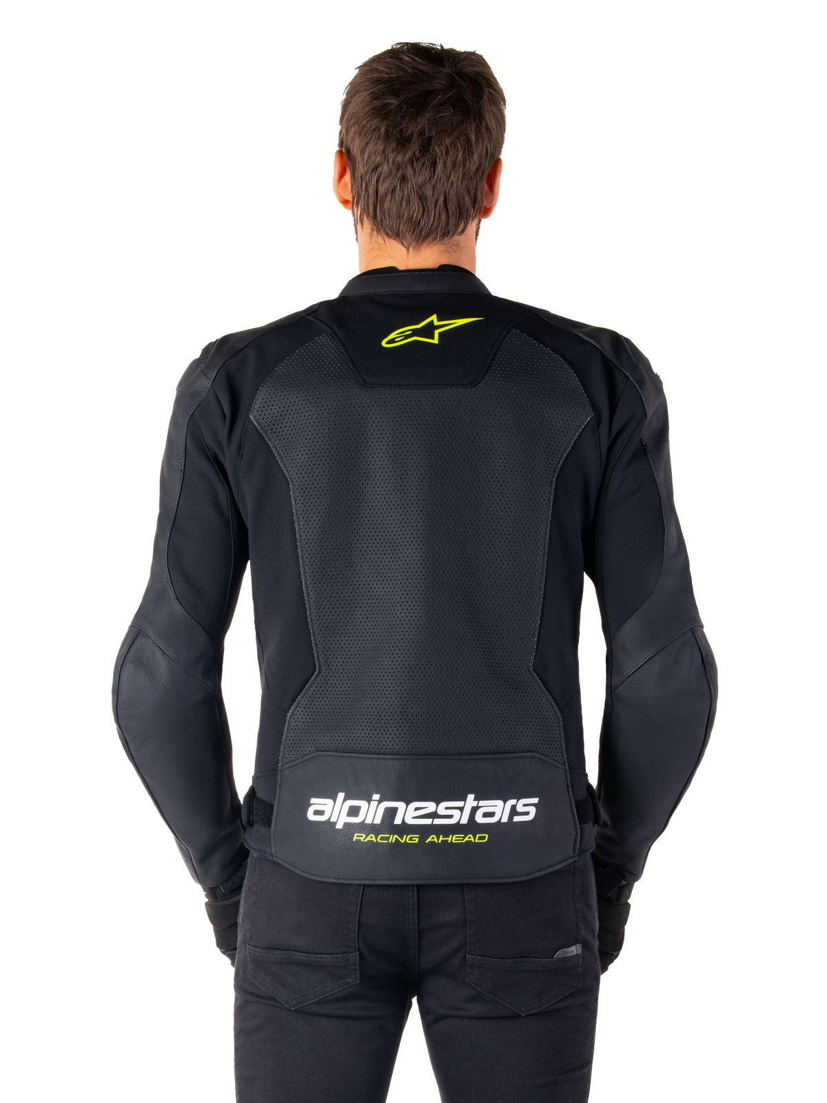 Alpinestars Faster V3 Airflow Leren Jas, sportief motorjack, zwart met Yellow Fluo accenten, achteraanzicht met grote geperforeerde leren panelen, geel sterlogo op de bovenrug en opvallende branding op de onderrug.