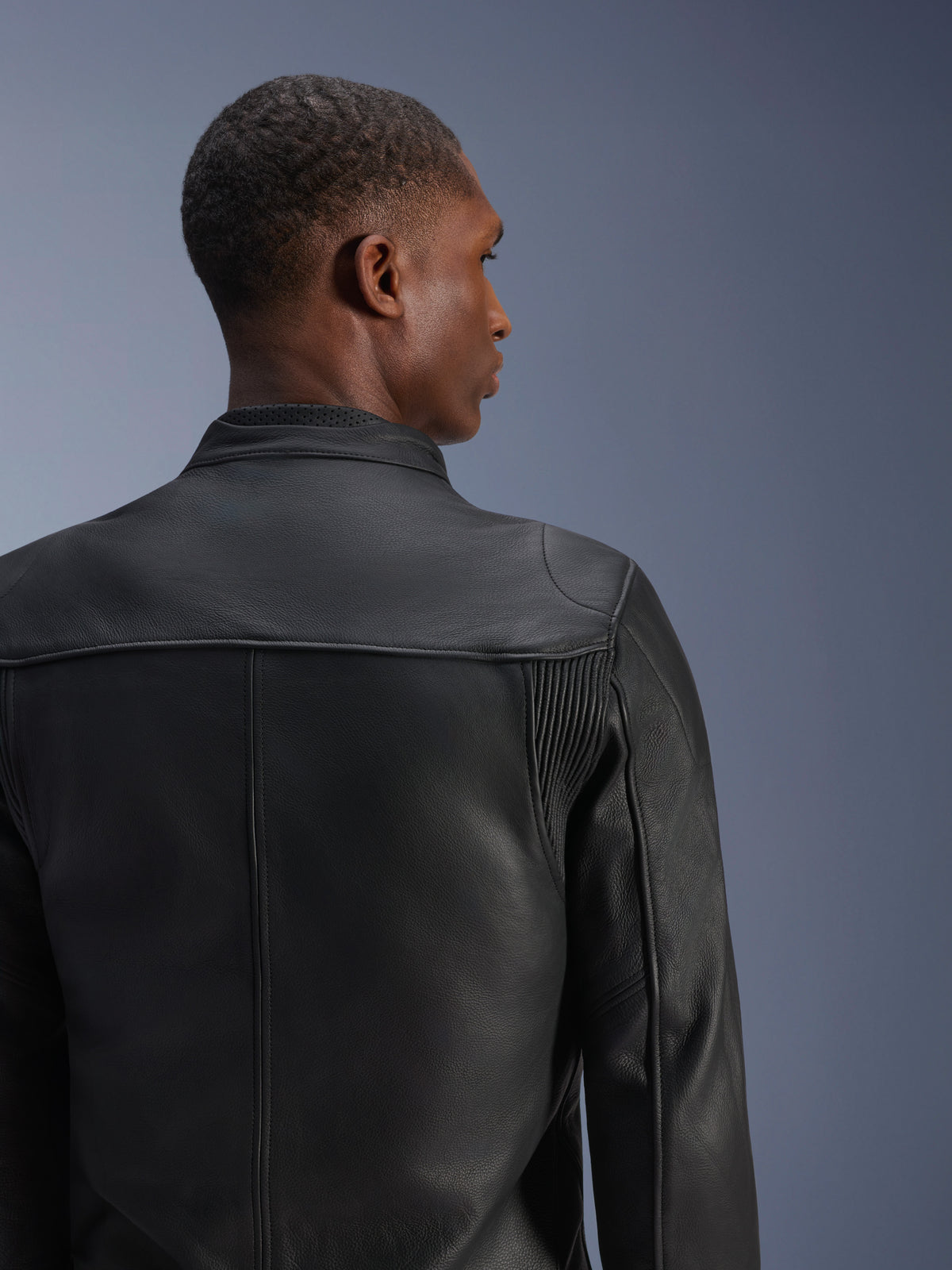 Alpinestars Blacktrack Leather Jacket, Men's Black bovine leather urban motorcycle jacket, back view with accordion panels.