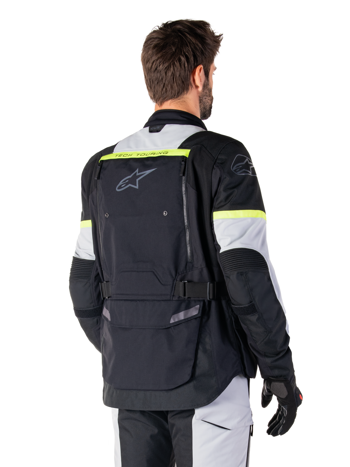 Alpinestars Bogotá Pro Drystar® Jas, adventure touring jas, Black Ice Gray en Yellow Fluo, achteraanzicht met groot achterzakpaneel met 'TECH TOURING'-branding, Alpinestars-logo en fluorescerende accenten, technische textiele motorkleding