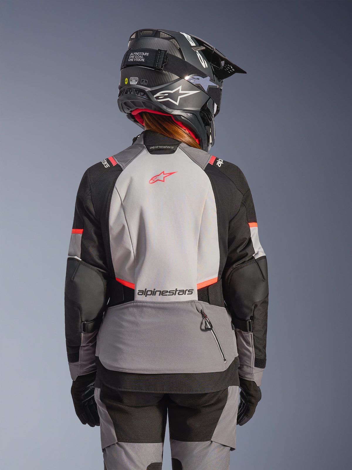 Alpinestars Stella Andes V4 Drystar® Women's Adventure Jacket in Gray and Black with Coral Fluo, back view on model.
