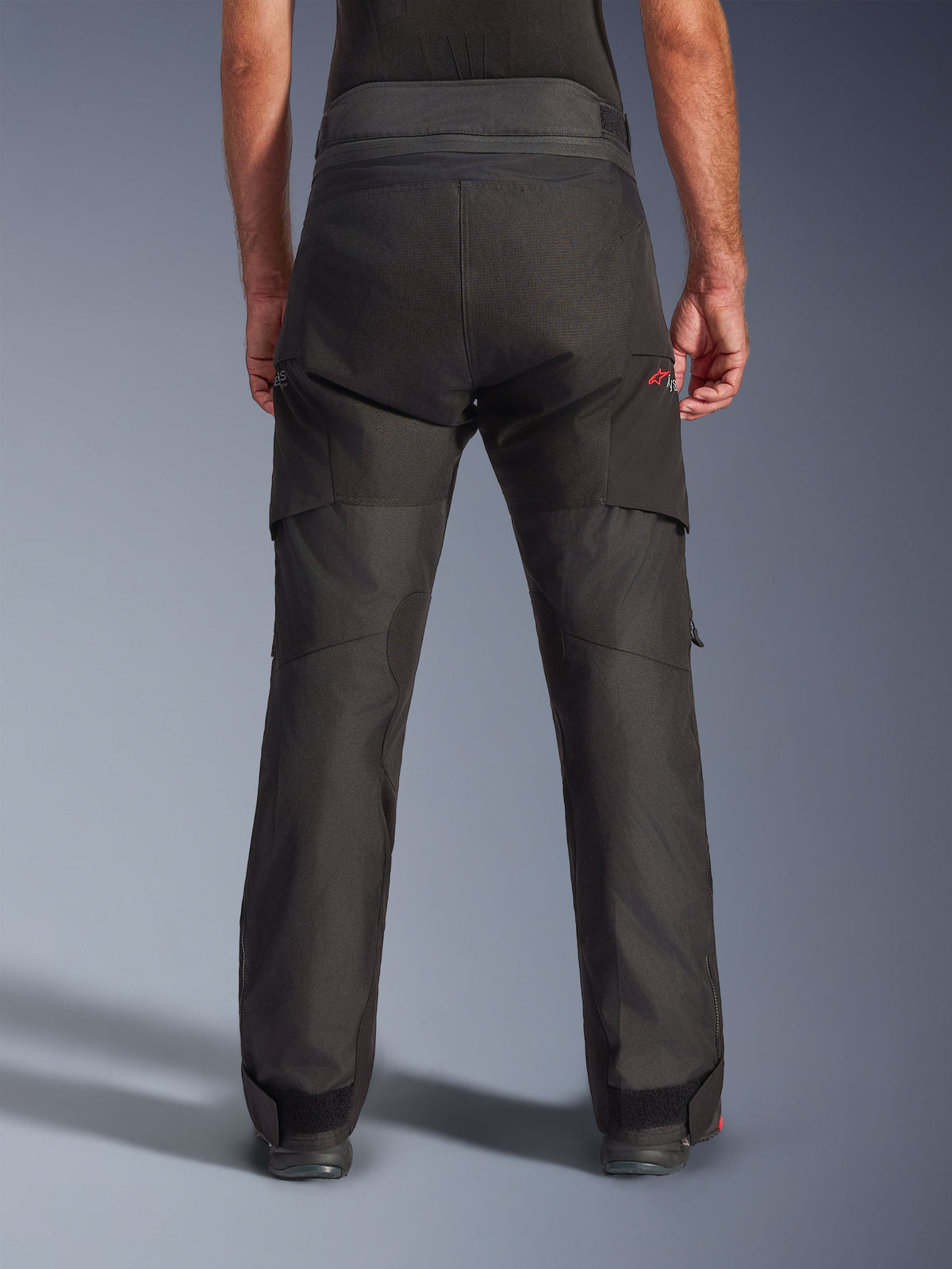Alpinestars Andes V4 Drystar® Pants, Textile Motorcycle Pants, Black, rear view showing reinforced panels and adjustable waist, adventure touring gear with red logo accents