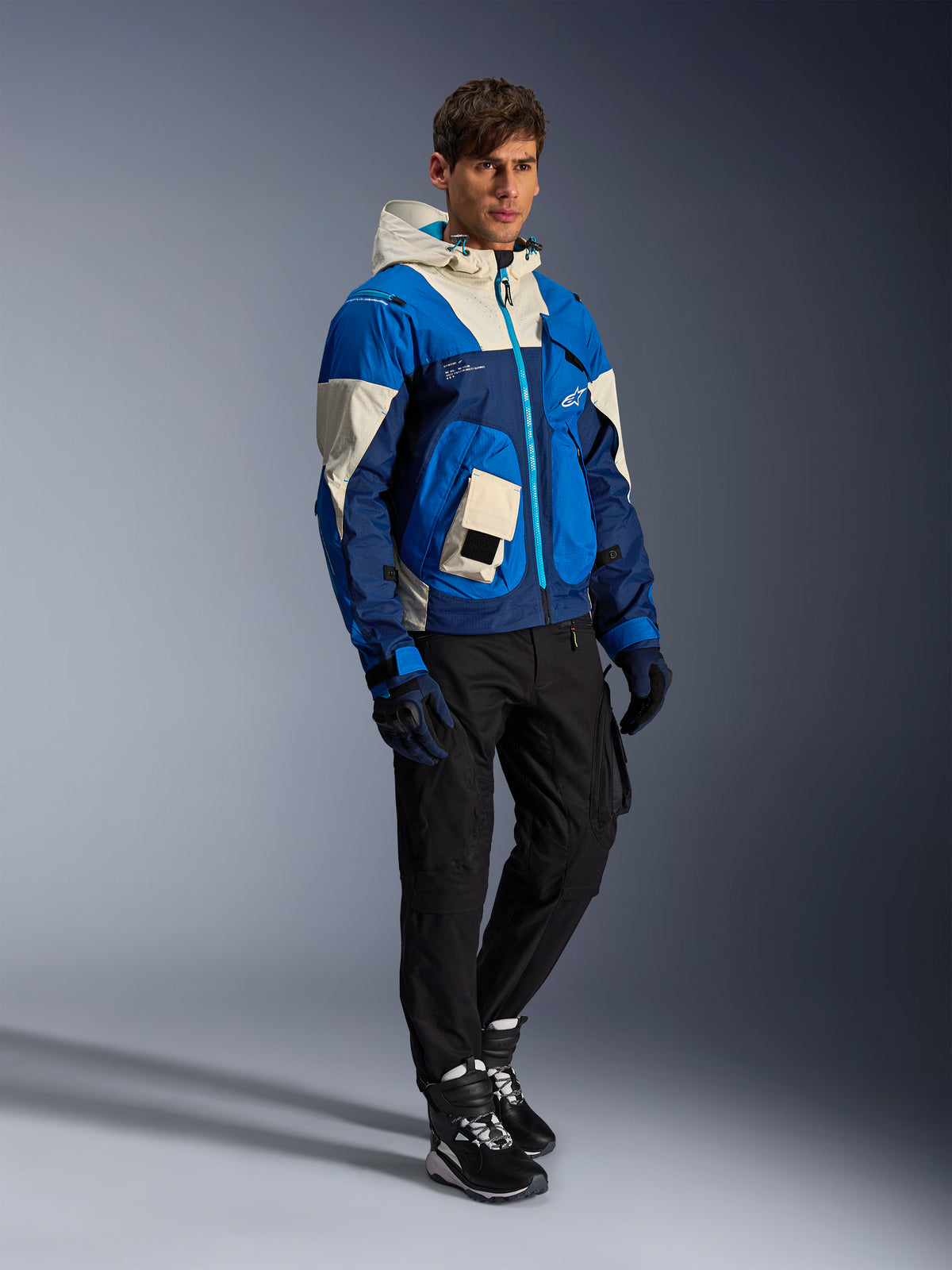 Alpinestars Mogress Air Jacket in Blue Almond, a men's textile urban motorcycle jacket with a hood and utility pockets.