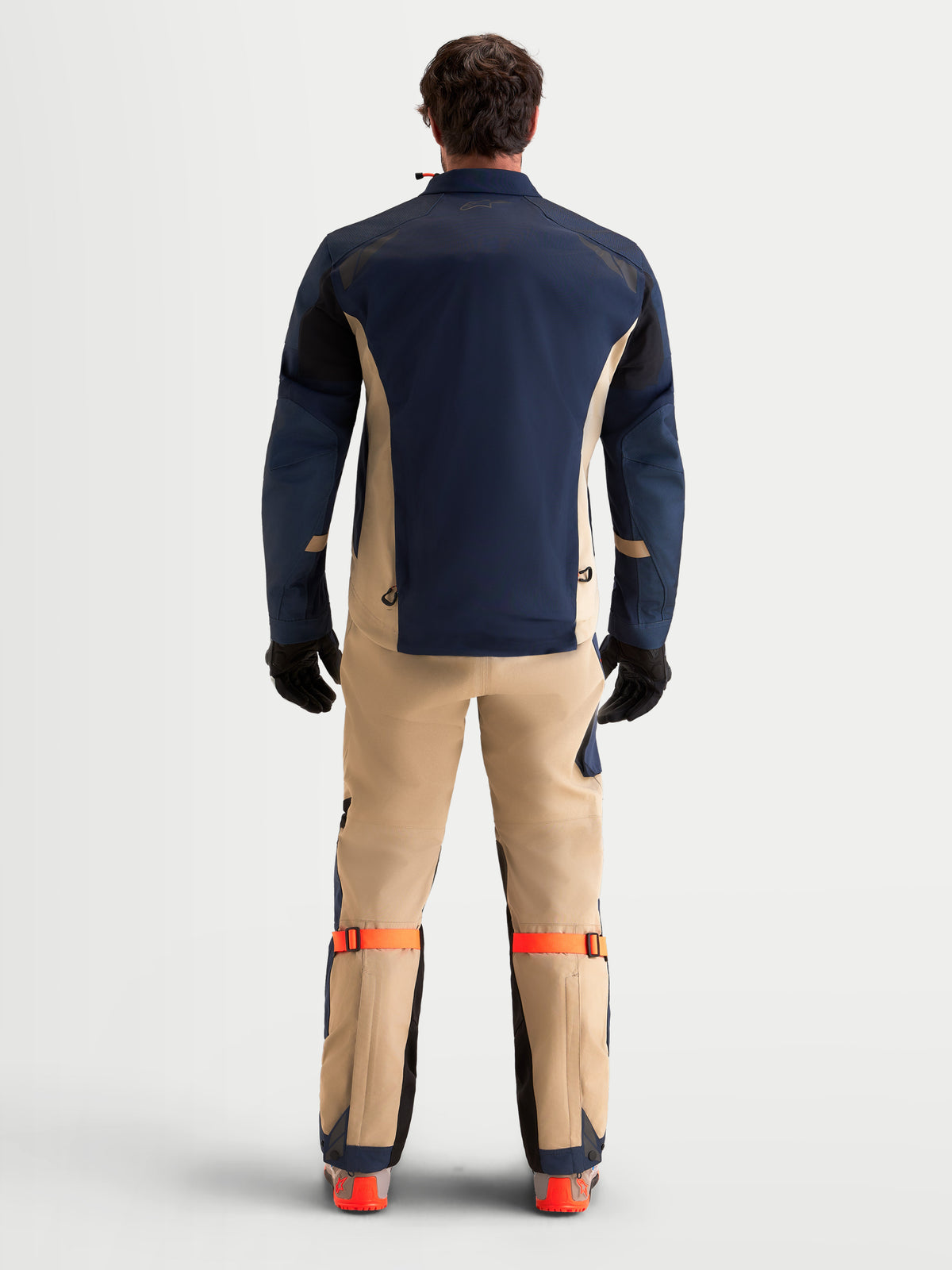 Alpinestars Arenis Gore-Tex Gear Set, men's adventure touring motorcycle jacket and pants in night navy and aluminum, rear view on a model wearing matching gear and gloves.