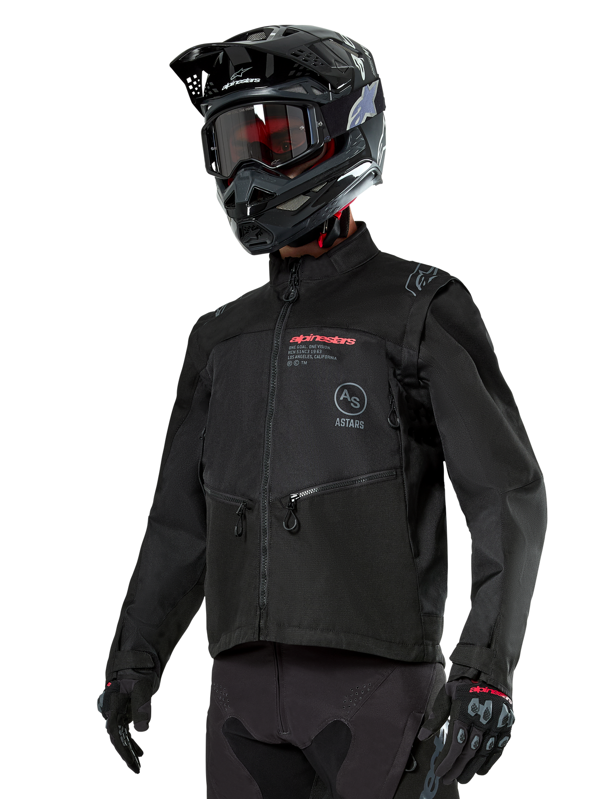 Alpinestars Pro-Dura Jas, off-road motorjas, zwart met rode en grijze logo's, voorzien van ritszakken en een hoge kraag, gedragen met een zwarte motorcrosshelm en handschoenen voor enduro-rijden