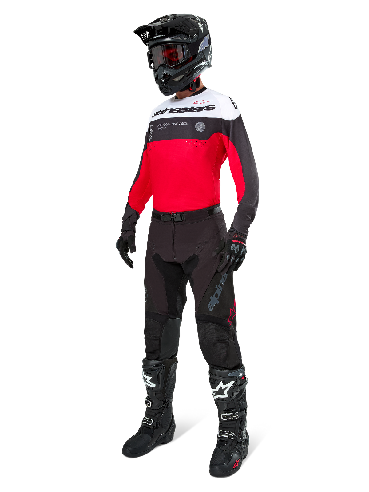Alpinestars Pro-Dura broek in Black Magnet White, gedragen door een rijder met een bijpassende rood, zwart en witte jersey, zwarte helm en zwarte off-road laarzen, complete professionele enduro race-uitrusting voor off-road prestaties.