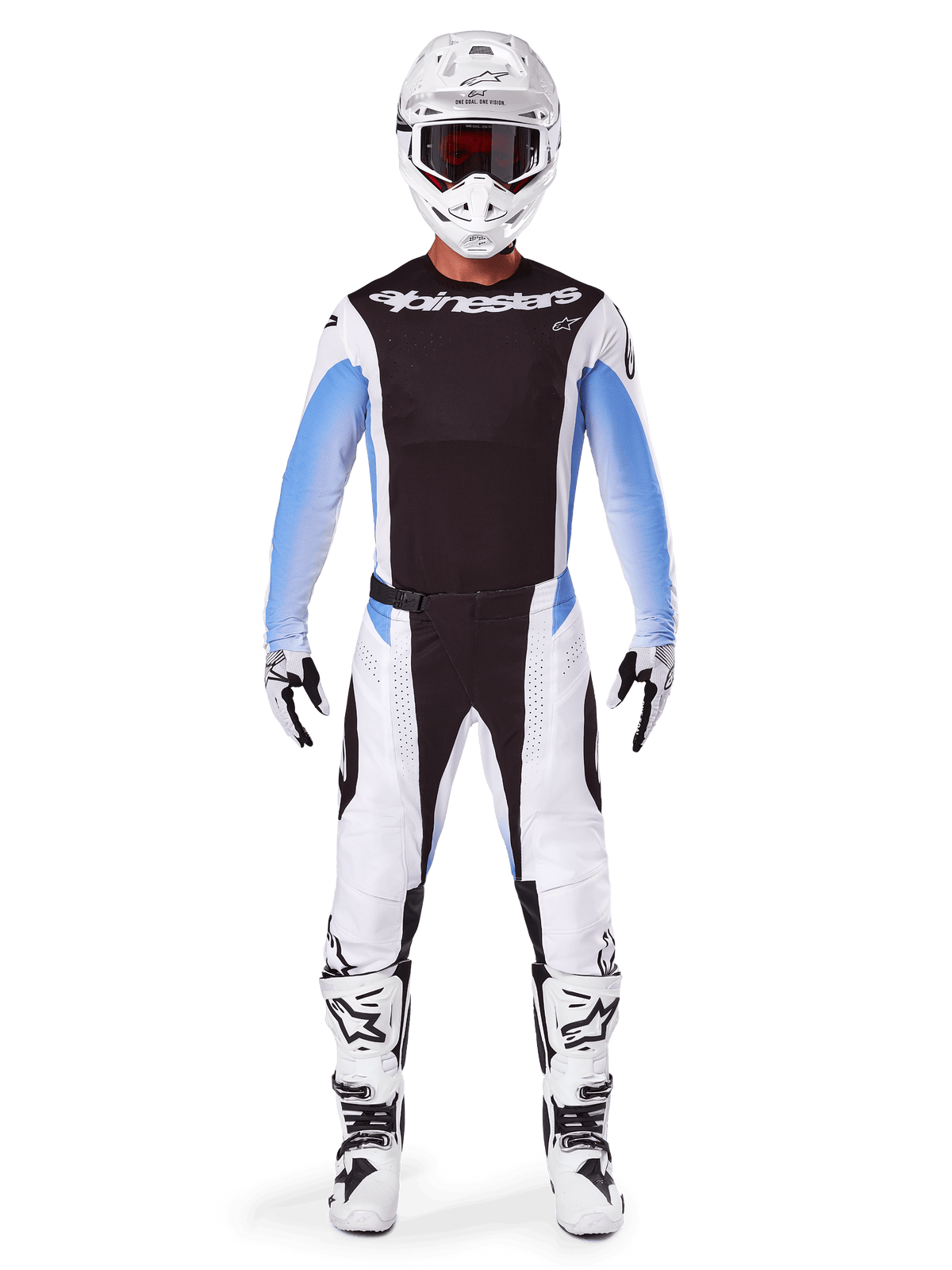 Motocrossrijder in Alpinestars 2025 Techstar Melt broek, motorcrossbroek, zwart en blauw, wit en zwart multi-panel ontwerp met blauwe heupaccenten, gedragen met bijpassende witte jersey, witte helm, witte handschoenen en laarzen voor een complete off-road race-uitrusting