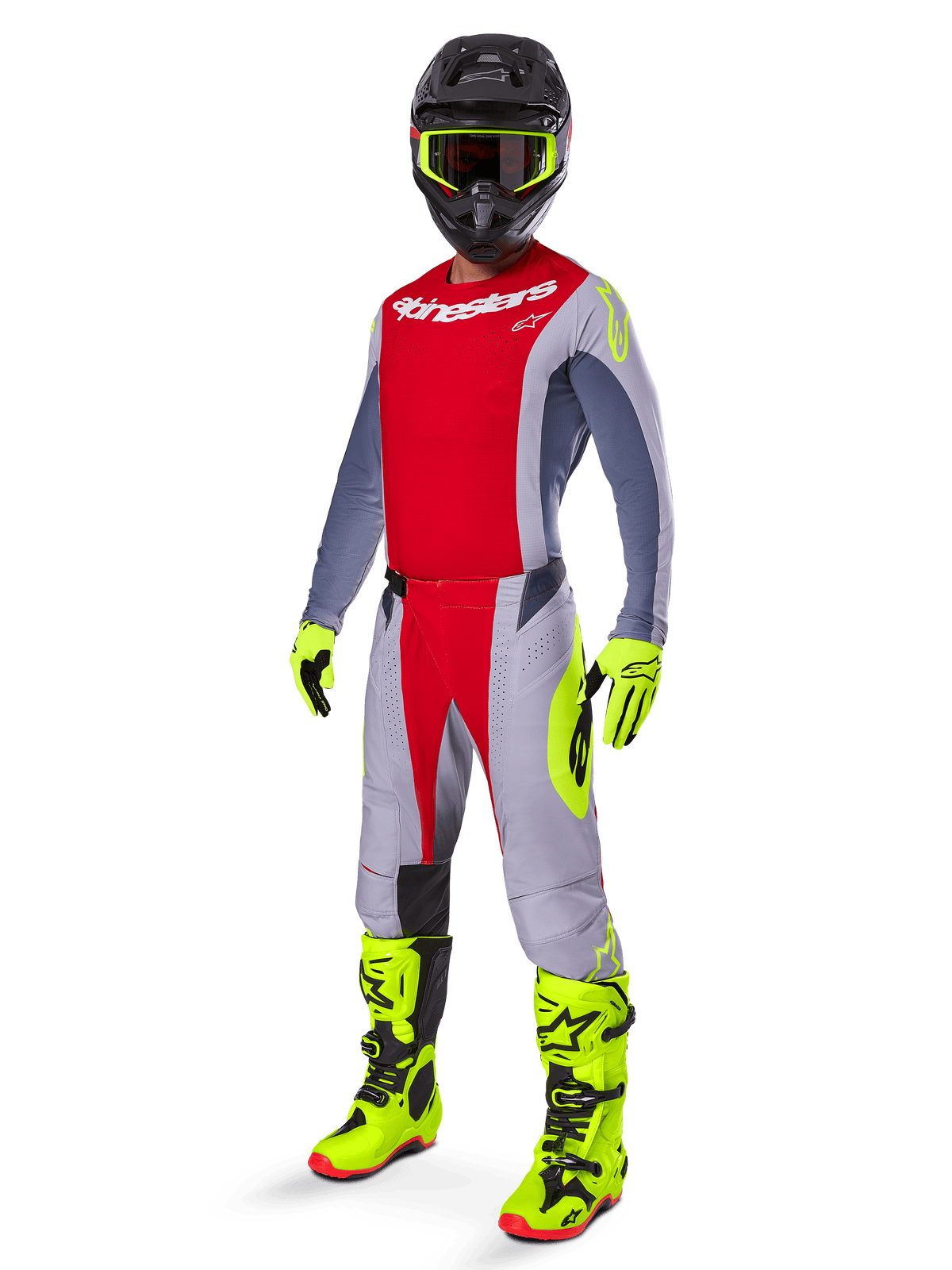 Alpinestars motocrossrijder in volledige race-uitrusting, 2025 Techstar Melt crossbroek in felrood en grijs met neongele accenten, bijpassend rood en grijs shirt, felgele laarzen en handschoenen, zwarte helm met neongele bril, gecoördineerde outfit voor off-road prestaties
