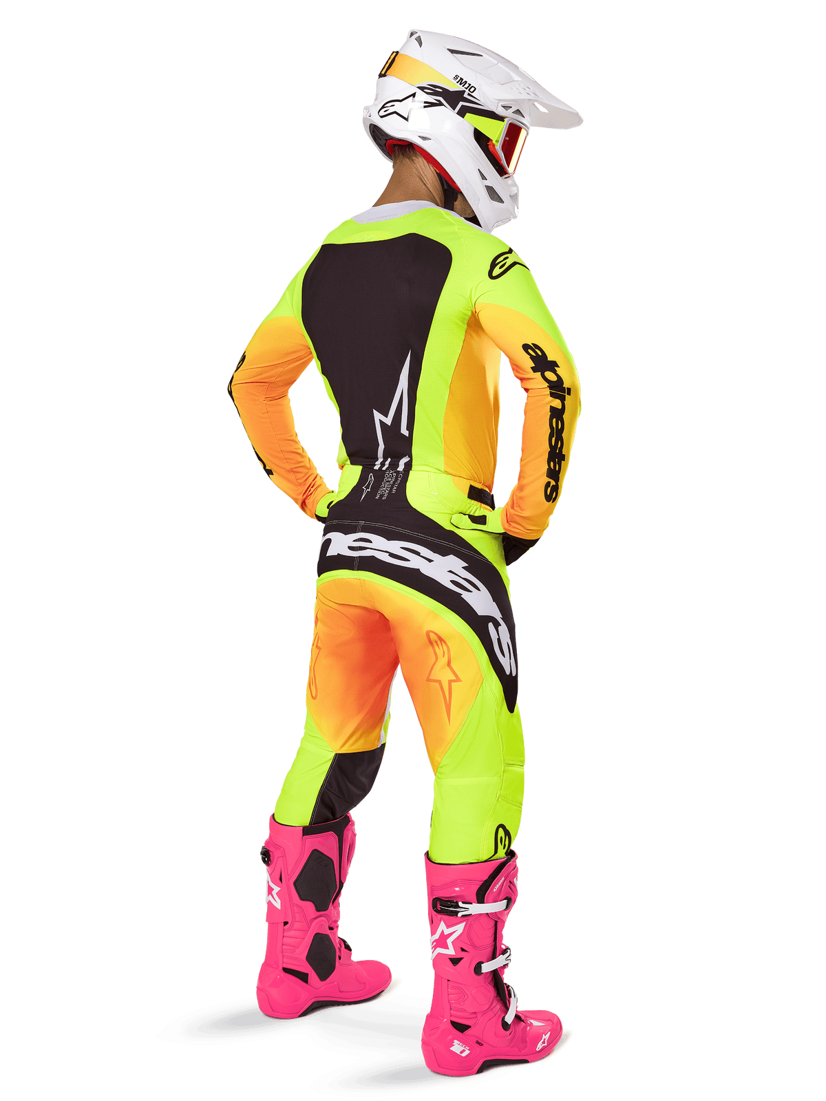 Alpinestars 2025 Techstar Melt Gear Set, motorcrosser van achteren gezien, geel en oranje gradiënt jersey en broek met zwarte panelen, witte helm met rode crossbril, felroze laarzen, gecoördineerde race-outfit voor off-road prestaties