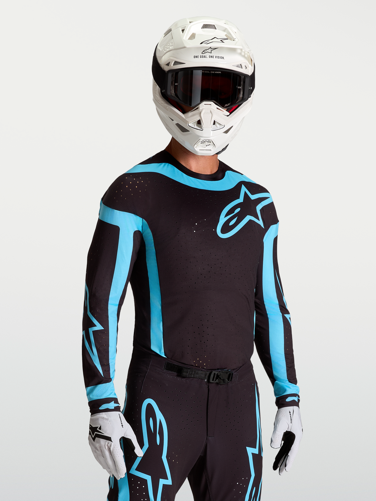 Alpinestars Supertech Vesta jersey, zwart en turkoois herenmotocrossjersey met laser-gesneden ventilatie en racepasvorm.