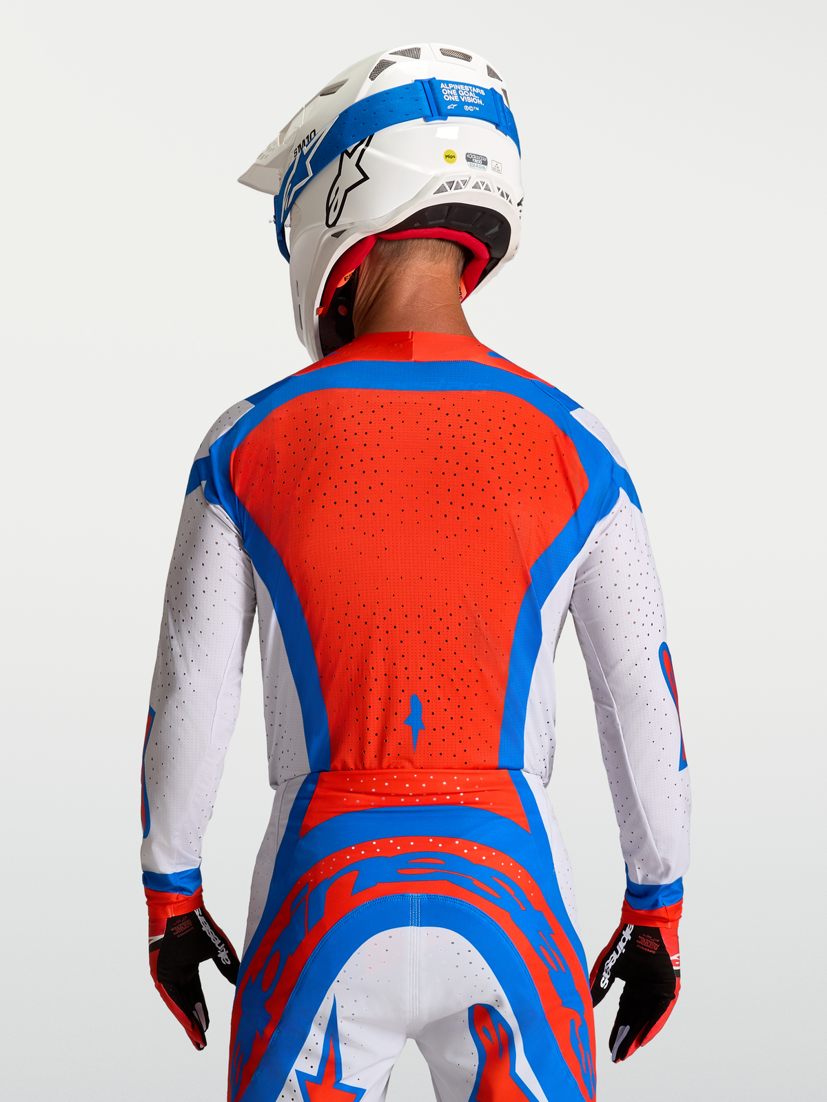 Alpinestars Supertech Vesta jersey in rood en wit met een geventileerd mesh rugpaneel voor professionele motorcross.