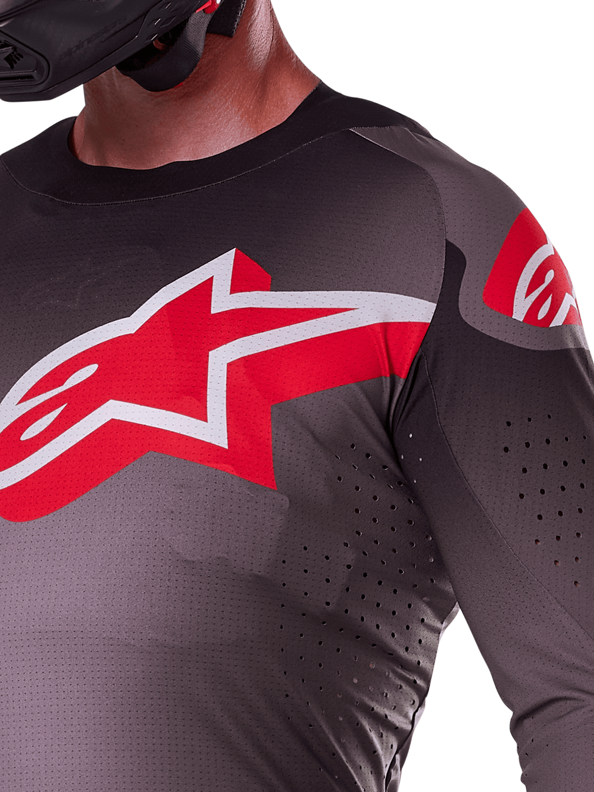 Alpinestars 2025 Supertech Lipan Jersey, Motocross Jersey, Smoke Bright Red, close-up view of chest and shoulder featuring red and white Alpinestars logo, laser-cut perforations for ventilation, lightweight stretch mesh material, athletic race fit