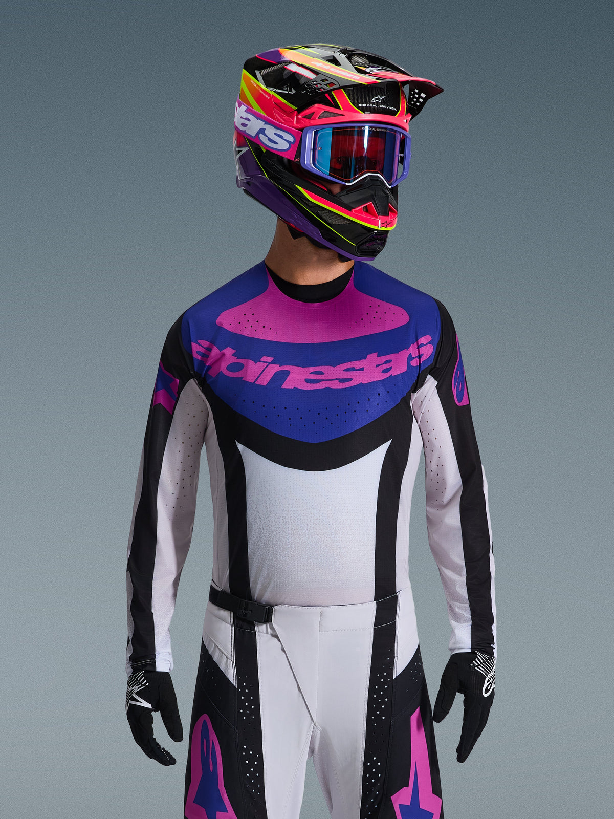 Alpinestars 2026 Techstar Knif Jersey, Motocross Jersey, Black Light Gray and Purple, pink Alpinestars logo on the chest, worn with matching colorful helmet and motocross pants, athletic race fit with laser-cut perforations for ventilation