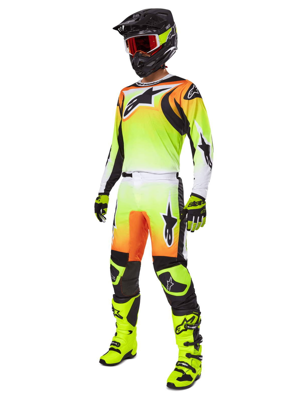 Alpinestars 2025 Fluid Wurx Gear Set, motorcross race-outfit, neongeel en oranje kleurverloop, complete set met jersey en broek, zwarte helm met oranje bril, neongele laarzen en handschoenen, atletisch ontwerp voor off-road prestaties