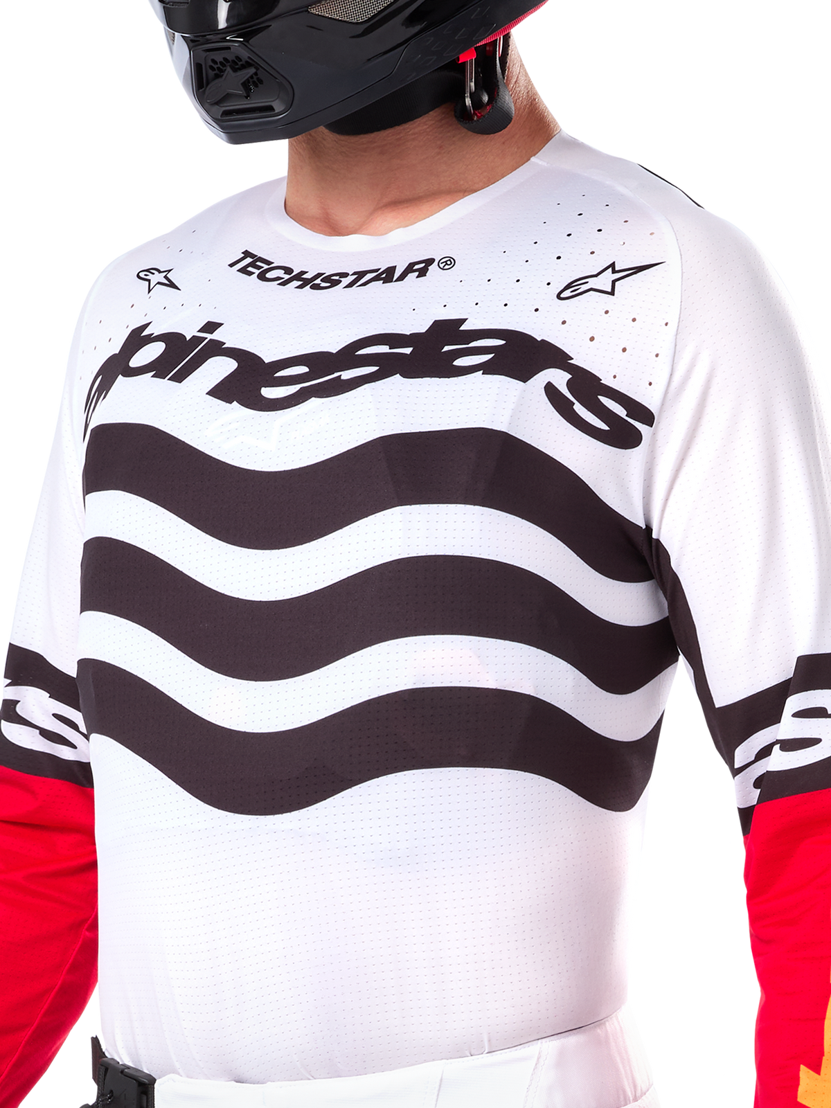 Alpinestars Limited Edition Techstar Deep Jersey, wit motorcross shirt met golvende zwarte horizontale strepen en rode mouwen, voorzien van Alpinestars- en Techstar-branding, kleine lasergesneden perforaties op de bovenborst voor ventilatie, sportieve off-road uitrusting
