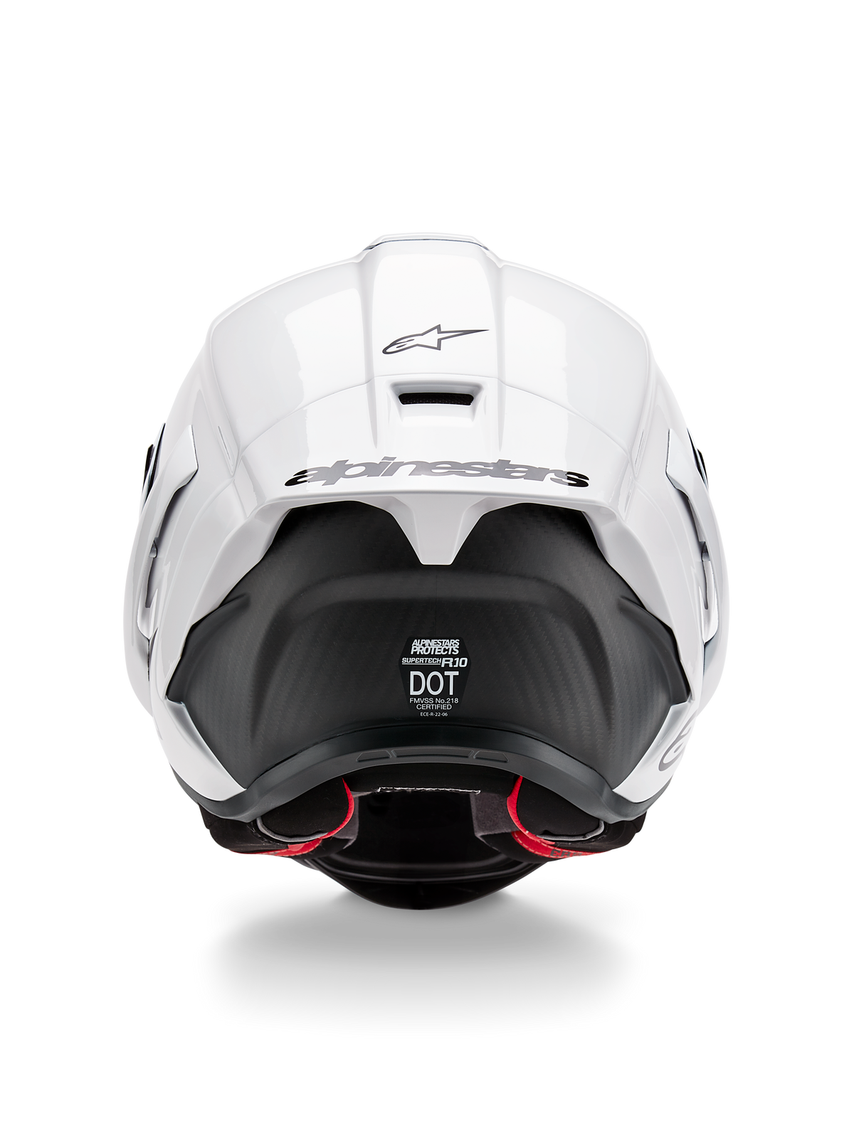 Alpinestars Supertech R10 Solid helm, achteraanzicht, glanzend witte bovenkant met matzwart onderste gedeelte, aerodynamische spoiler met zwart Alpinestars-logo, zichtbare koolstofvezeltextuur en veiligheidscertificeringsstickers