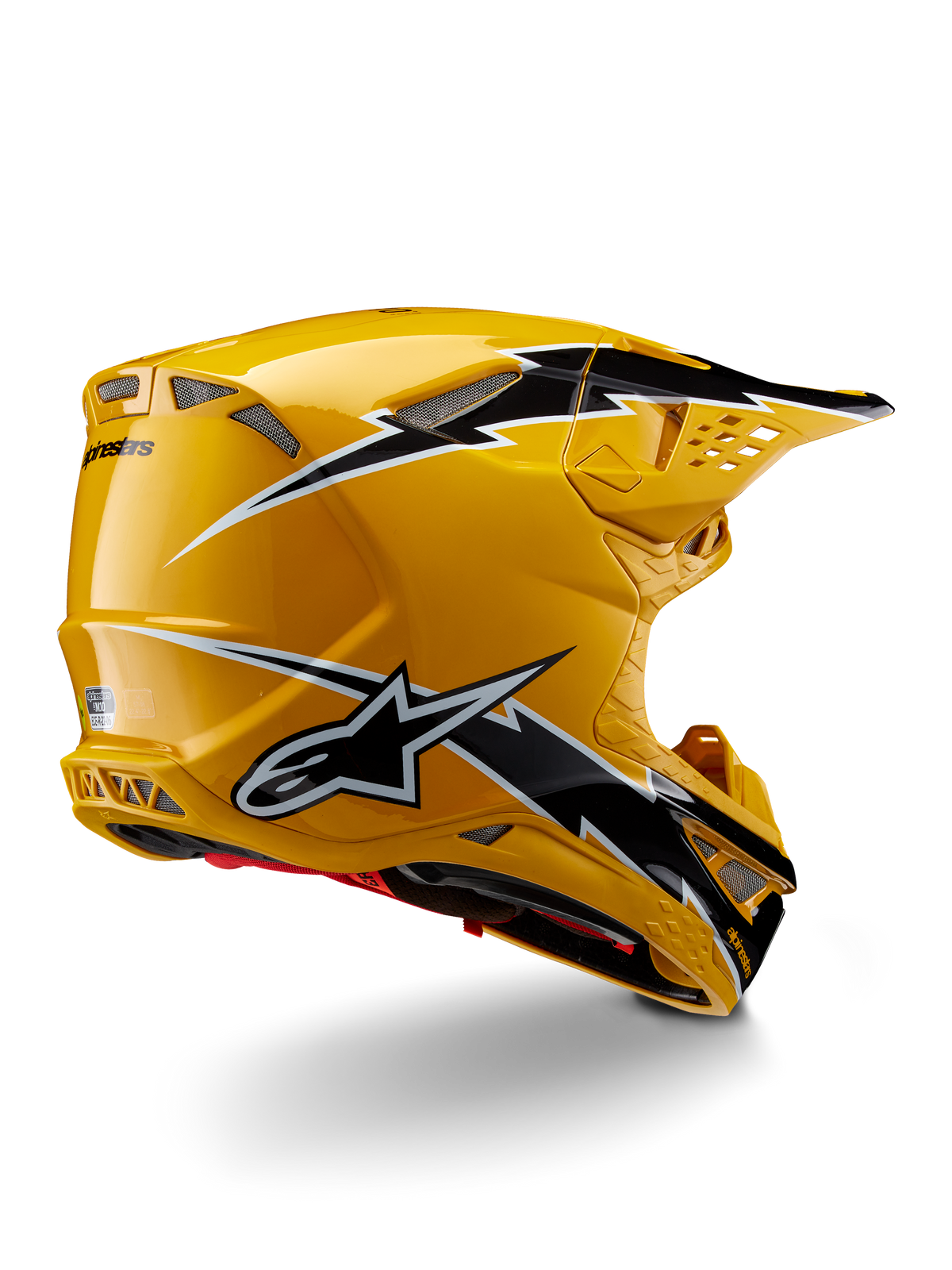 Alpinestars Supertech M10 Ampress helm, motorcrosshelm, glanzend zwart en geel, met een hoogglans gele afwerking en zwart-witte graphics in bliksemstijl, driekwart achteraanzicht met aerodynamische schaal en geïntegreerde ventilatieopeningen.