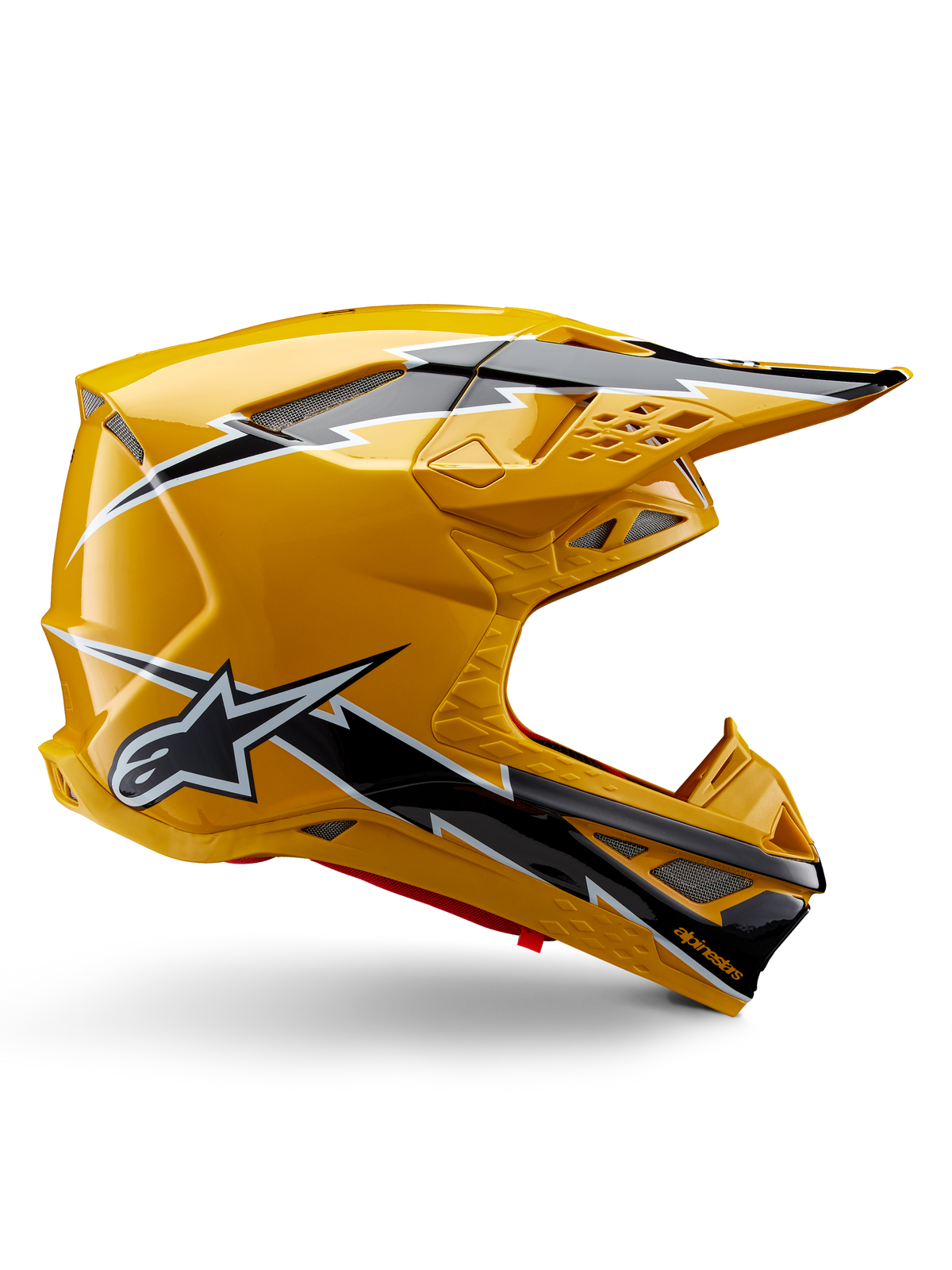 Alpinestars Supertech M10 Ampress helm, motorcrosshelm, glanzend zwart en geel, zijprofiel met opvallende zwart-witte bliksemgraphics, Alpinestars sterlogo, aerodynamisch ontwerp met geïntegreerde ventilatiepoorten en verstelbaar vizier.