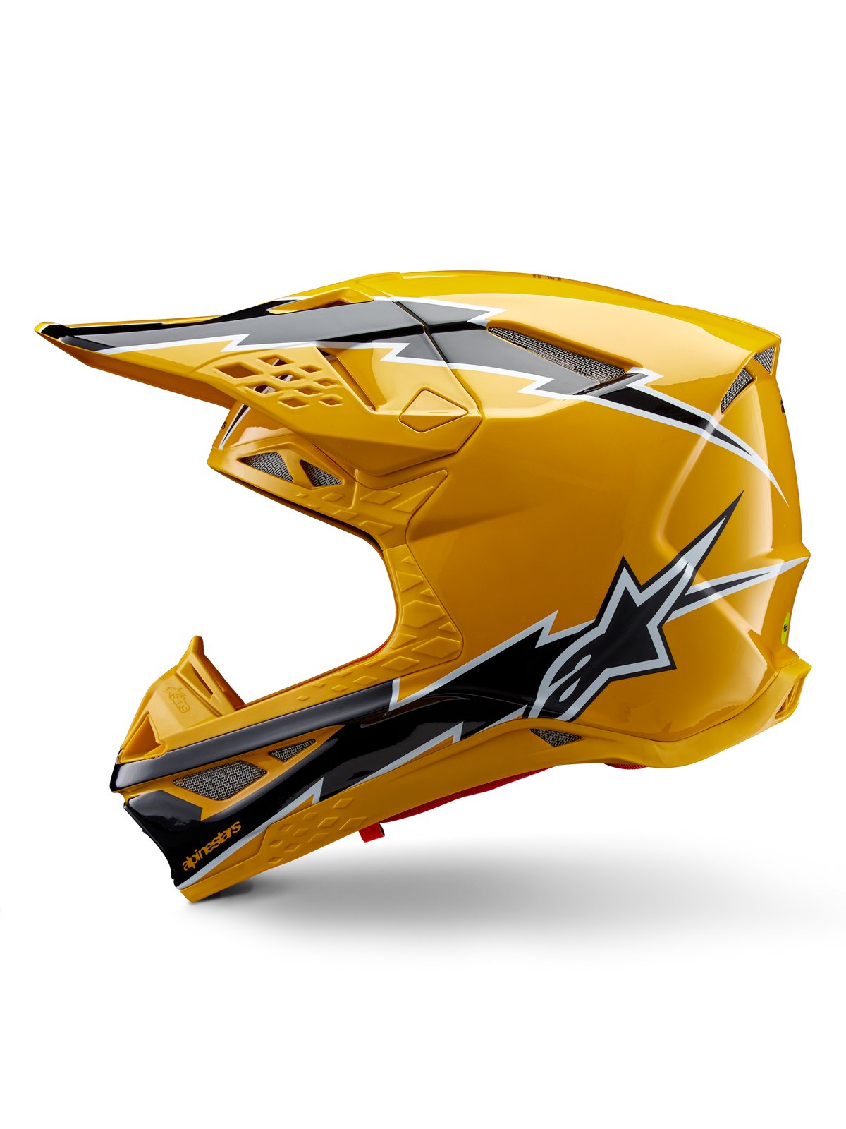 Alpinestars Supertech M10 Ampress helm, motorcrosshelm, glanzend geel met zwart-witte graphics, zijaanzicht met opvallende hoekige ontwerpen, Alpinestars sterlogo en meerdere ventilatieopeningen met zilverkleurig gaas, professionele off-road race-uitrusting