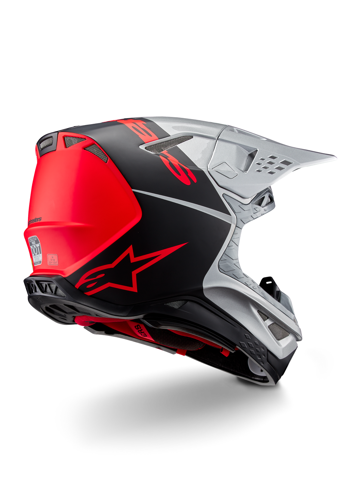 Alpinestars Supertech M10 Flood ECE 22.06 Helm, motorcrosshelm, zilver, zwart en fluo oranje, zij-achteraanzicht met nadruk op het aerodynamische schaalontwerp, ventilatieopeningen en mat-glanzende afwerking