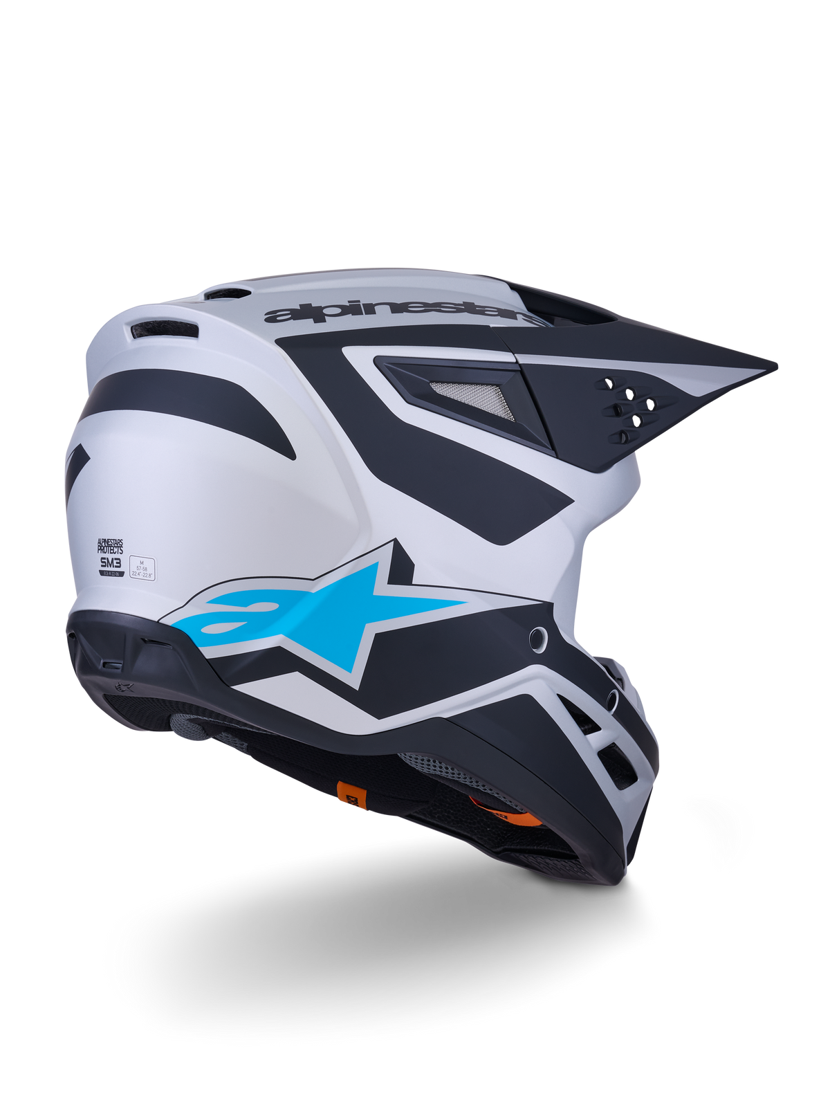 Alpinestars S-M3 Heat Helm ECE 22.06, motorcrosshelm, zilverblauw en matzwart, achteraanzicht met groot blauw sterlogo en zwarte hoekige ontwerpen, aerodynamische schaal met ventilatieopeningen, hoogwaardige bescherming voor off-road racen