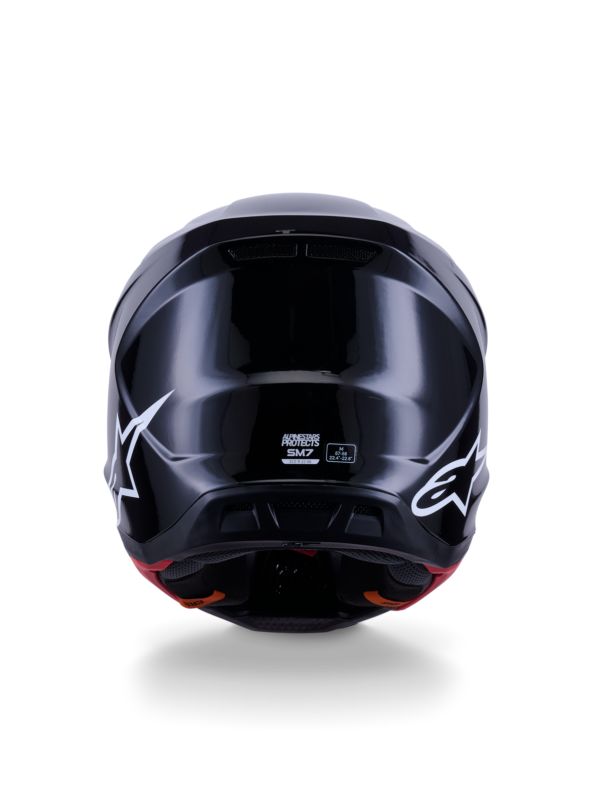 Alpinestars S-M7 Solid Helm ECE 22.06, motorcrosshelm, glanzend zwart, achteraanzicht met witte sterlogo's, aerodynamische composietschaal met een hoogglans afwerking, veiligheidscertificering en maataanduidingen in het midden