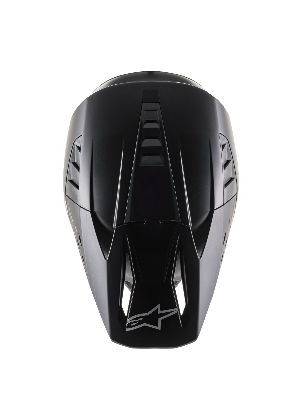 Alpinestars S-M5 Solid Helm ECE 22.06, motorcrosshelm, matzwart, bovenaanzicht van de aerodynamische schaal met ventilatieribbels, vizier met luchtinlaatopeningen en Alpinestars-logo, strakke matte afwerking ontworpen voor off-road racing.