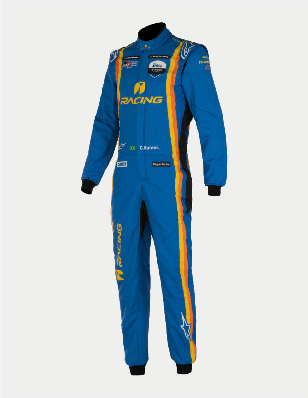 Alpinestars Tech Vision V3 Op Maat Gemaakt Pak, blauw autoracepak met gele en oranje strepen, FIA-gecertificeerd.
