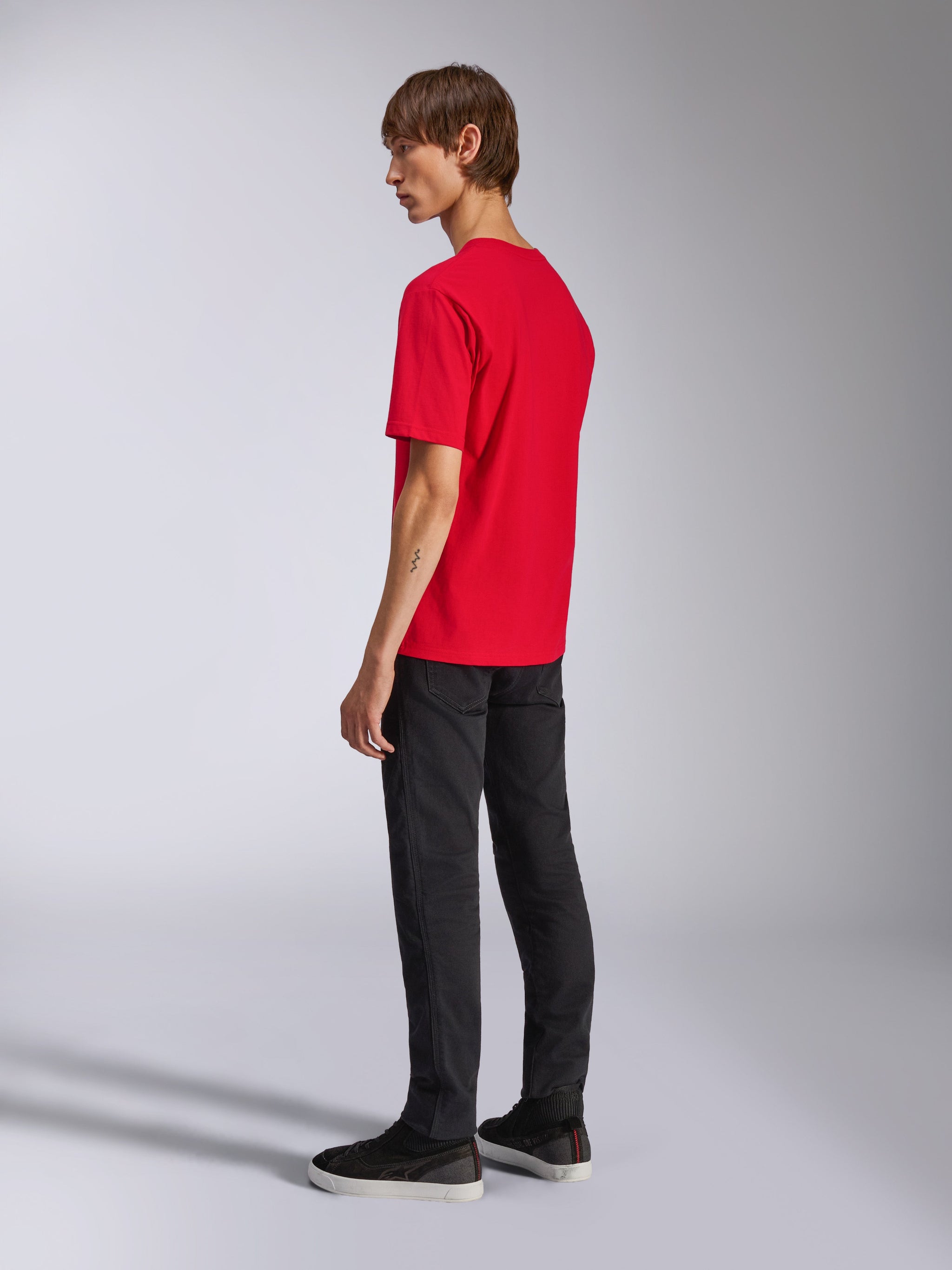 Alpinestars Ageless Shadow CSF Tee, Short Sleeve T-Shirt, Red, back view on model, worn with black pants and sneakers, casual motorsport-inspired streetwear