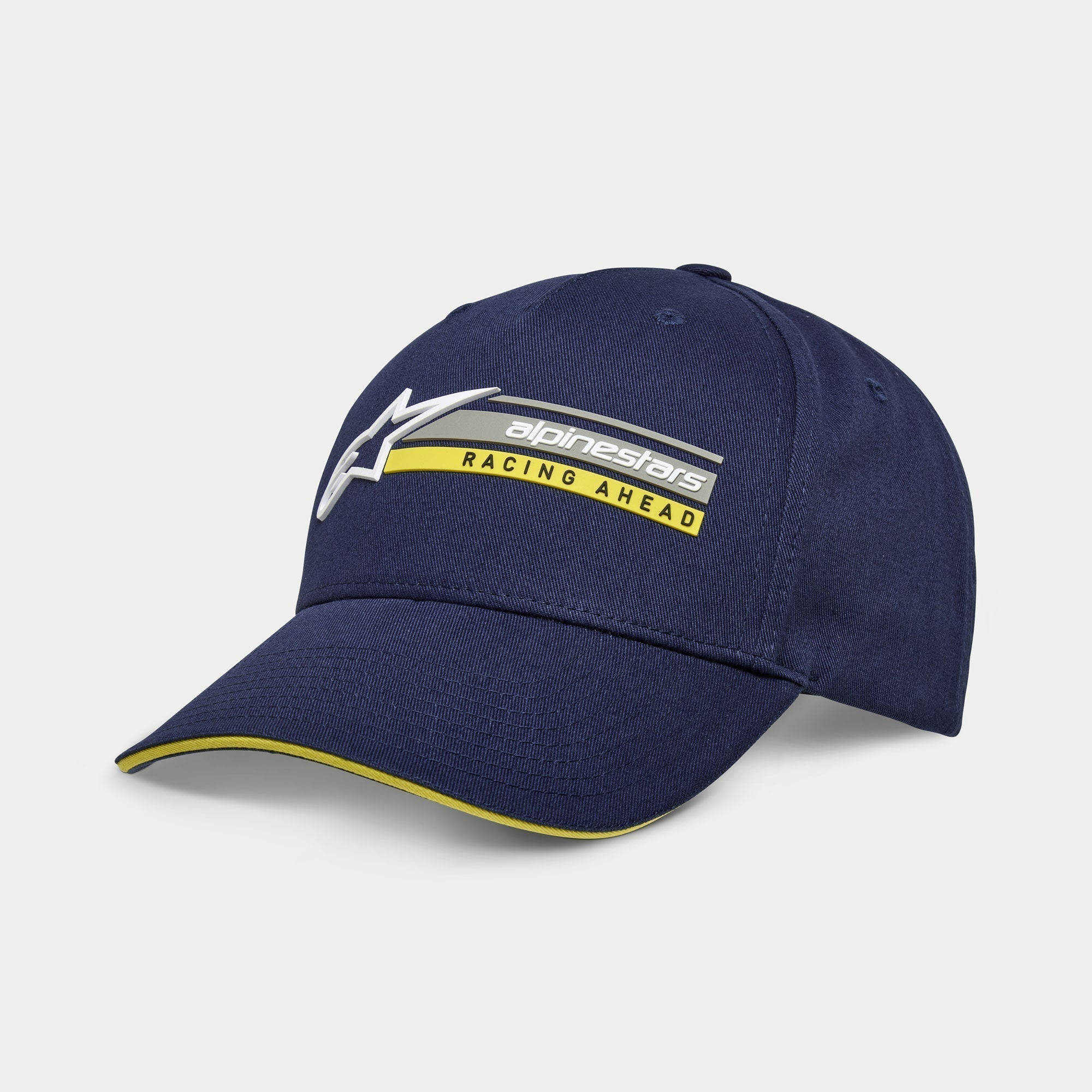 Alpinestars Par pet, marineblauwe snapback cap, gebogen klep met gele sandwich-rand, 3D geborduurd logo met 'Racing Ahead' graphic, casual motorsport-geïnspireerde hoofdbedekking