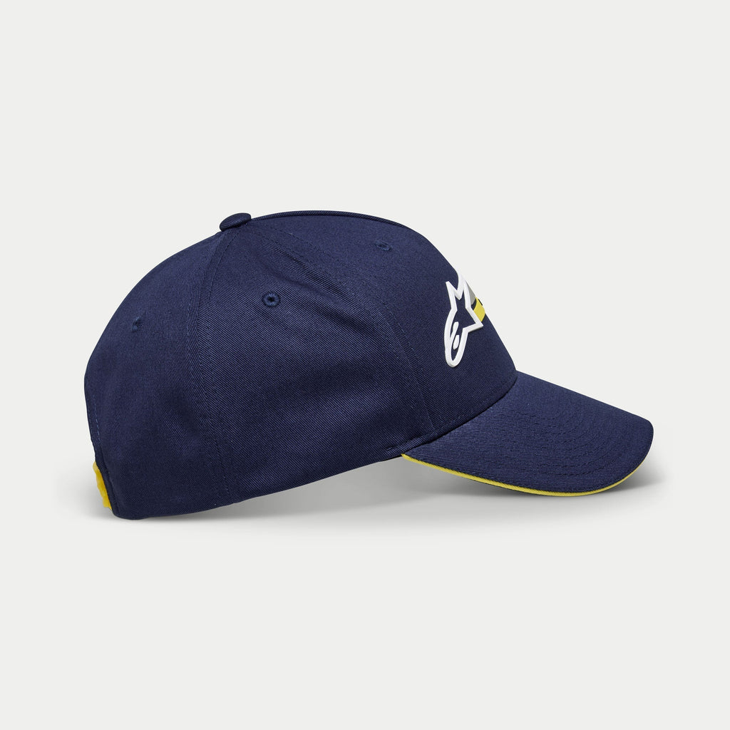 Alpinestars Par pet, donkerblauwe baseballpet, zijaanzicht met wit en geel geborduurd logo, gebogen klep met gele sandwich-bies, casual gestructureerde pet
