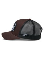 Alpinestars Heritage Patch Trucker pet, bruin en zwart, zijaanzicht met bruine twill voorkant en zwarte mesh achterkant, witte Ageless logo patch aan de zijkant, gestructureerde kroon en gebogen klep