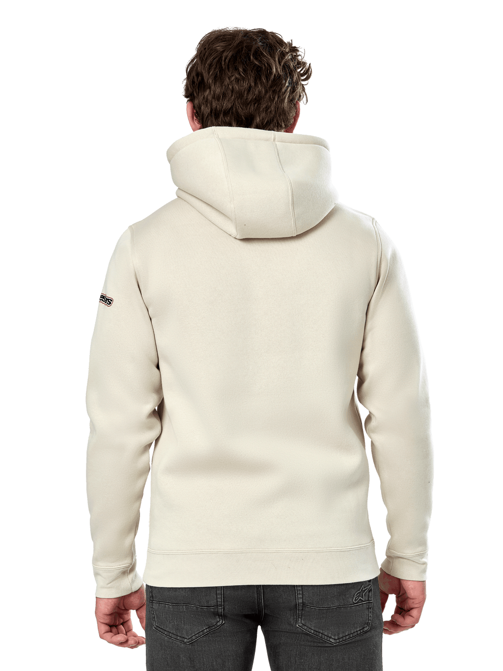 Alpinestars Insignia Hoodie, achteraanzicht van een man die een casual pullover fleece draagt, Off White, met een zelfgevoerde capuchon en ribboorden, motorsport-geïnspireerde streetwear