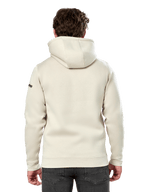 Alpinestars Insignia Hoodie, achteraanzicht van een man die een casual pullover fleece draagt, Off White, met een zelfgevoerde capuchon en ribboorden, motorsport-geïnspireerde streetwear