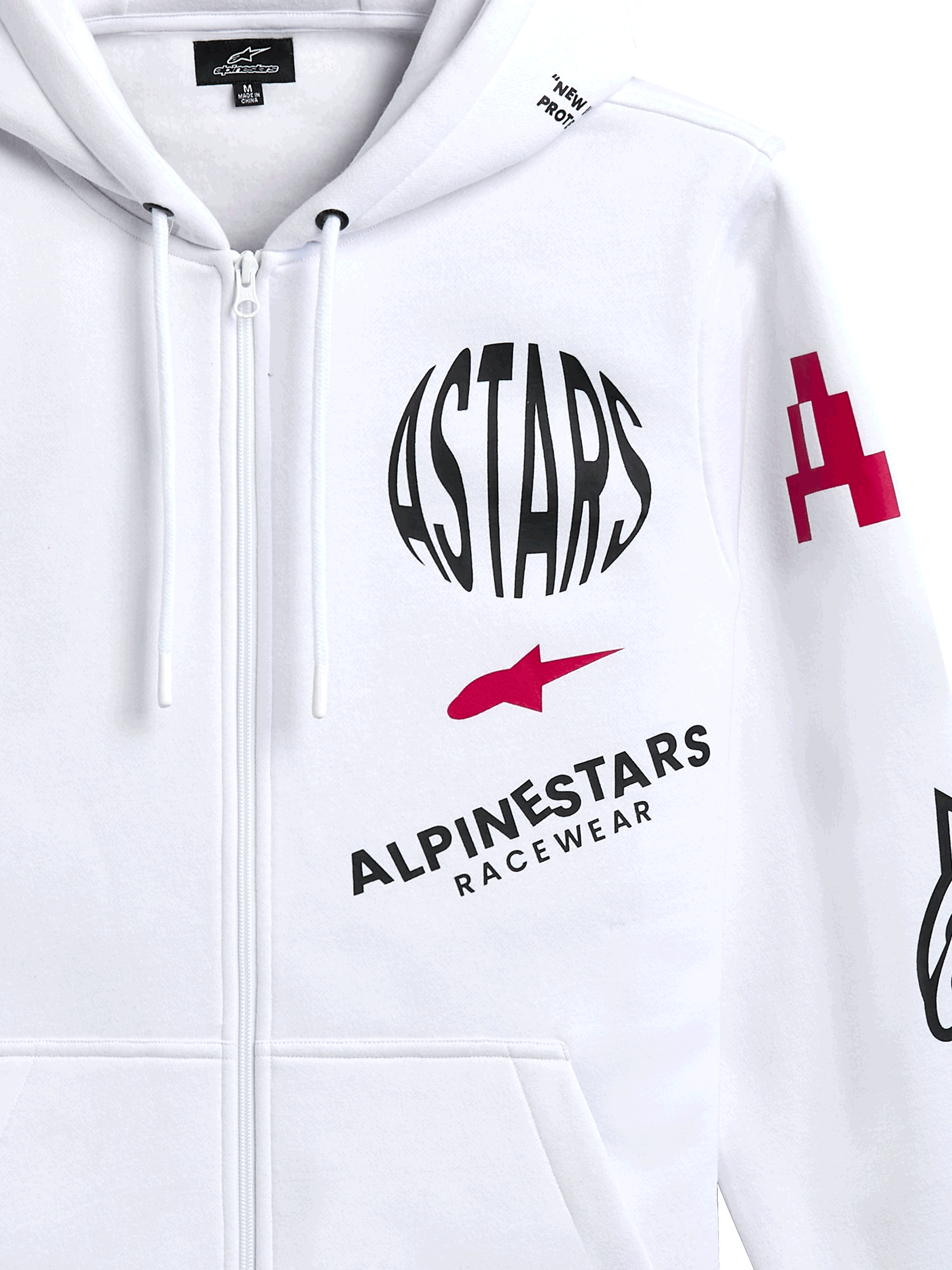 Alpinestars Variegate hoodie, witte fleece hoodie met ritssluiting aan de voorkant, voorzien van een rond zwart ASTARS-logo, rood stersymbool en Alpinestars Racewear-branding op de borst, casual motorsport streetwear