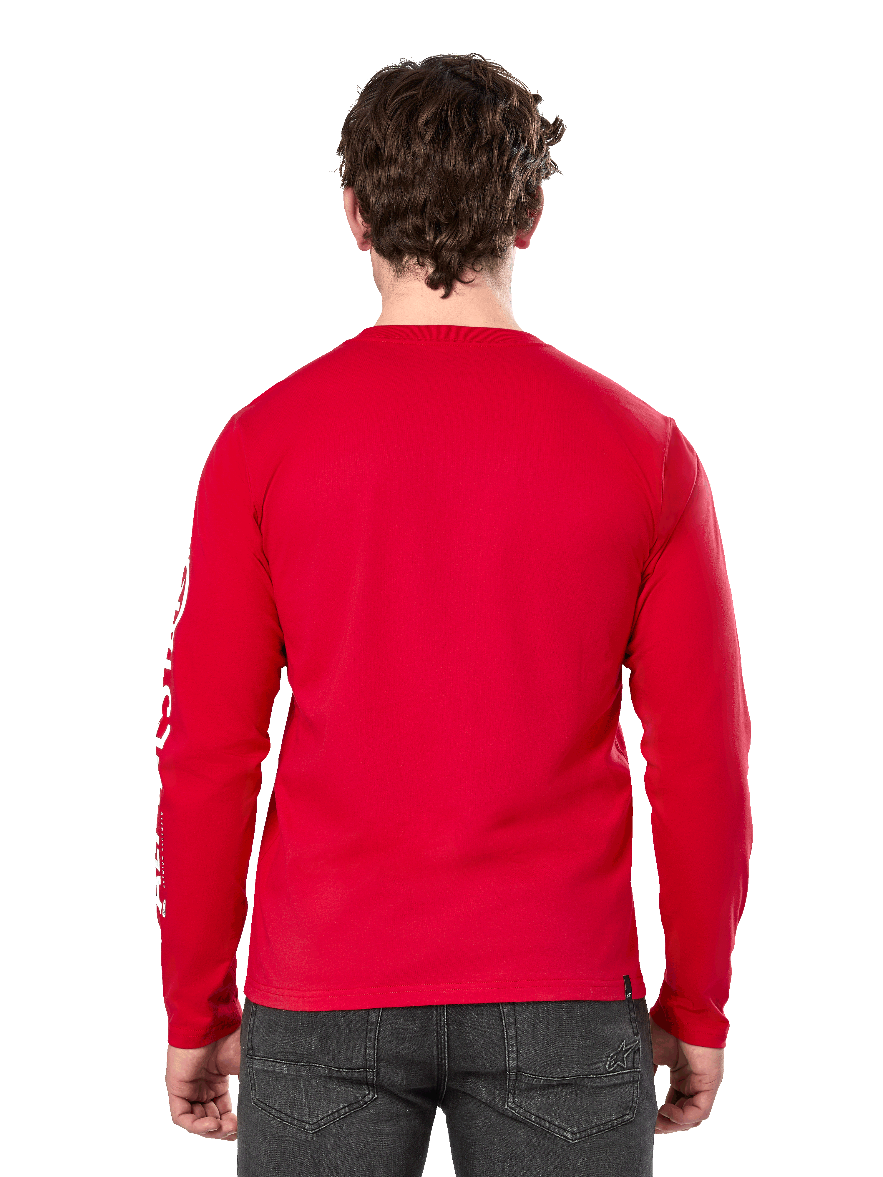Achteraanzicht van een man die het Alpinestars Committed CSF longsleeve T-shirt in het rood draagt, gecombineerd met een donkergrijze jeans, met een zichtbaar wit Alpinestars-logo op de mouw en een minimalistisch ontwerp op de rug.